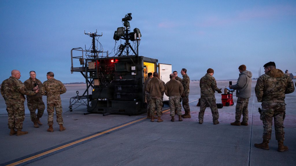 Airmen assigned to the 319th Reconnaissance Wing, prepare to execute a Point Defense Battle Lab exercise on the flightline at Grand Forks Air Force Base, North Dakota, Feb. 13, 2026. The PDBL serves as a hub for collaboration, pushing boundaries in Couter-small Unmanned Aircraft System capabilities, ensuring the Air Force maintains tactical superiority against evolving threats, and is a key part of the service’s effort to develop and evaluate advanced technologies to defend installations from sUAS threats. (U.S. Air Force photo by Airman 1st Class Emma Teel)