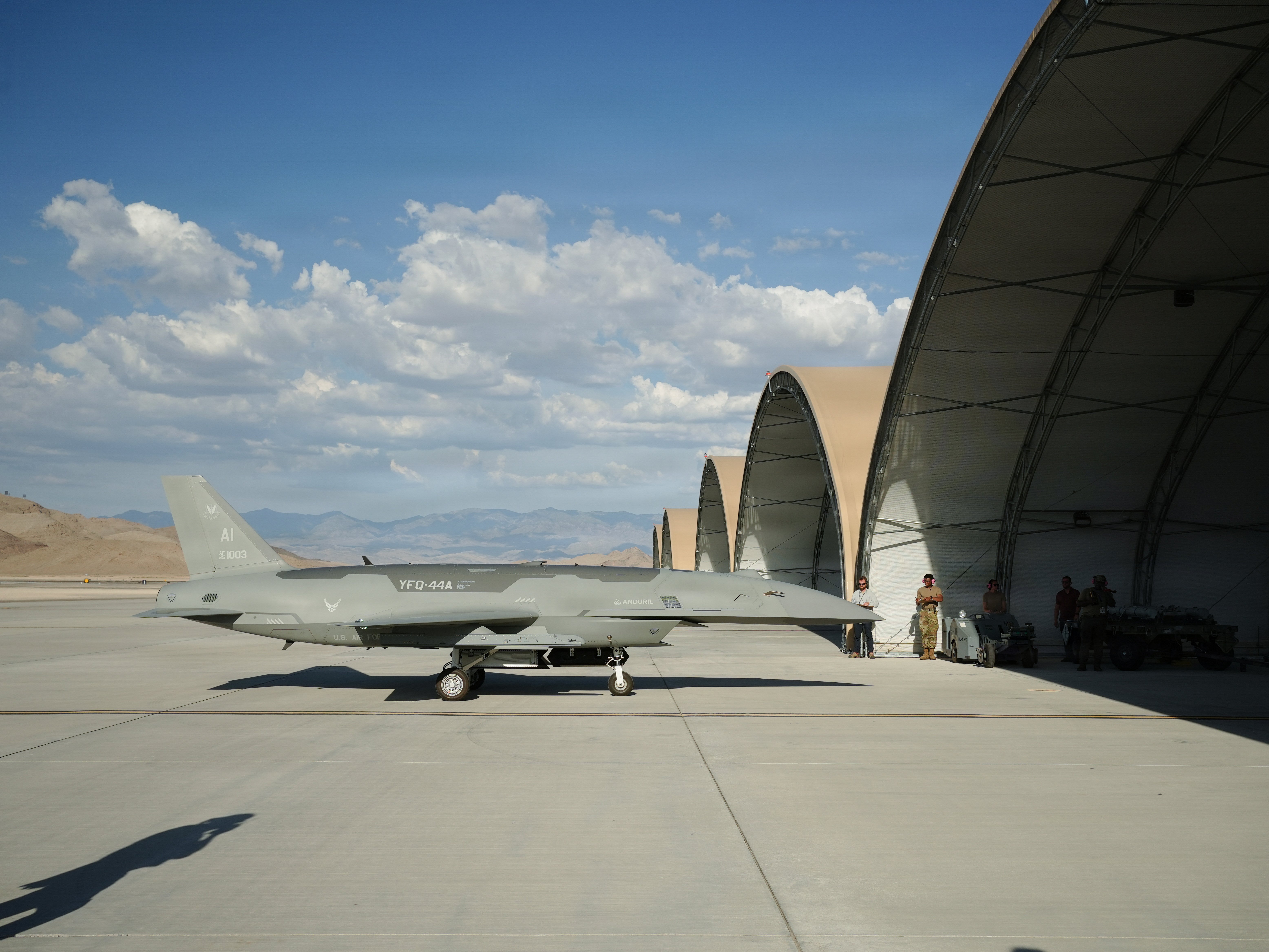 A YFQ-44A Fury aircraft assigned to the Collaborative Combat Aircraft Experimental Operations Unit taxis toward a sunshade at Creech Air Force Base, Nevada, July 20, 2026. The CCA took part in an Agile Combat Employment exercise that provided information necessary to validate the reduced logistical footprint required to operate in remote, forward-deployed locations. (U.S. Air Force photo by Senior Airman Renee Blundon)