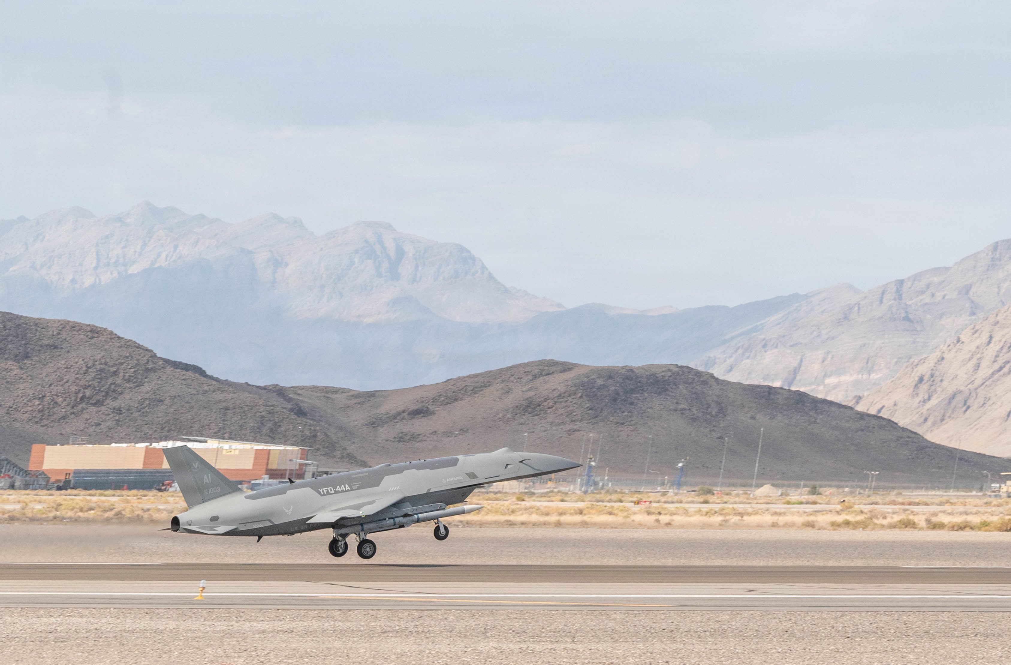 A U.S. Air Force YFQ-44A Fury aircraft, assigned to the Collaborative Combat Aircraft Experimental Operation Unit, takes off for a mission flight during an Agile Combat Employment exercise at Creech Air Force Base, Nevada, July 21, 2026. The flight was part of a broader ACE exercise designed to test the resilience, adaptability, and combat effectiveness of the semi-autonomous fleet. (U.S. Air Force photo by Staff Sgt. Kristal Munguia)
