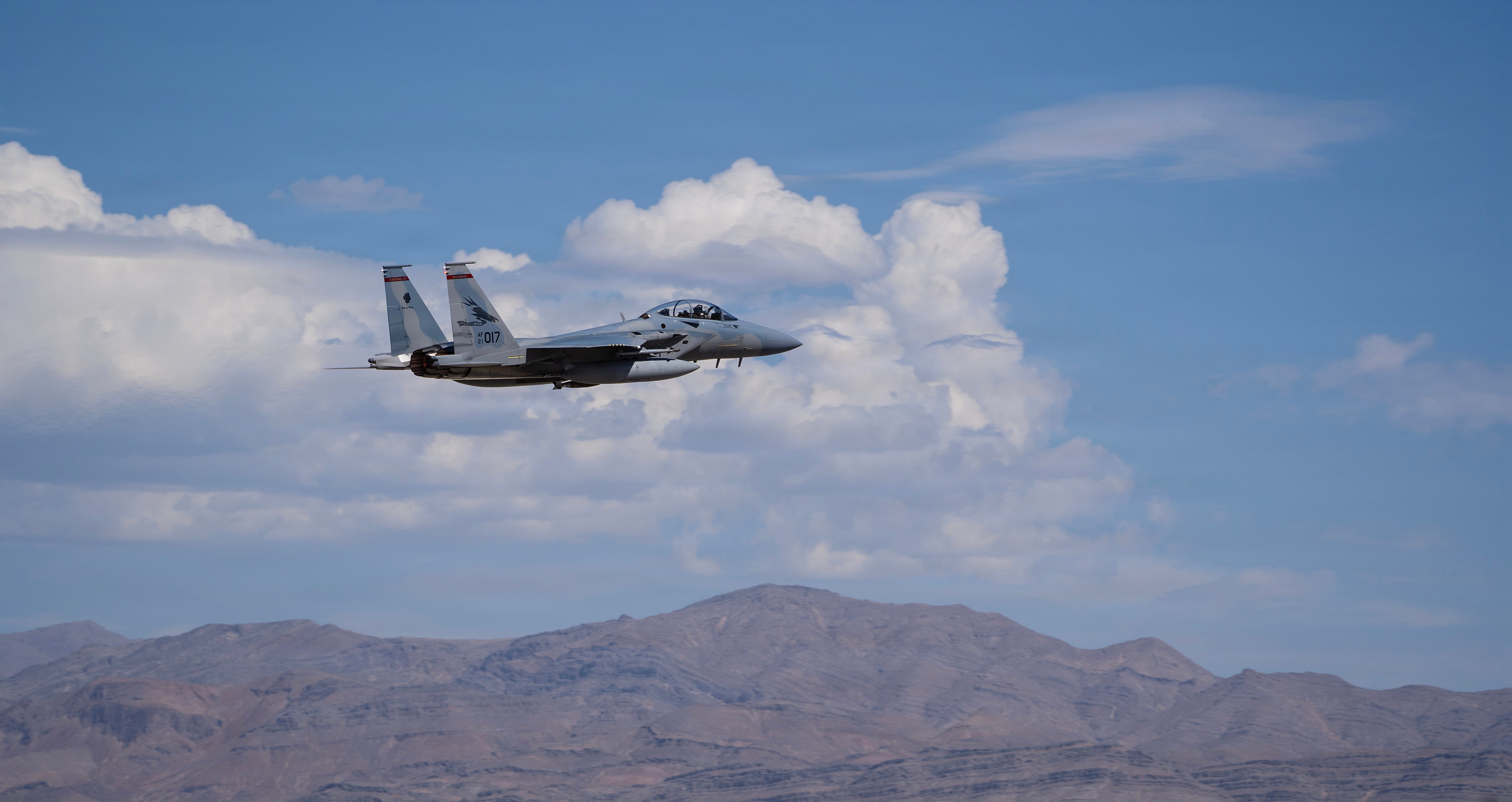 An F-15EX Eagle II aircraft assigned to the Oregon Air National Guard’s 142nd Wing takes off from Nellis Air Force Base (AFB), Nevada with a bomb attached to its belly, August 27, 2026. The 142nd Wing’s fleet of F-15EXs operated out of Nellis AFB for three weeks in late August and early September in support of the U.S. Air Force’s Weapons Instructor Course (WIC). During this time, the unit hit a historical milestone, dropping live bombs from operational F-15EXs for the first time. (U.S. Air National Guard photo by Master Sgt. Steph Sawyer)