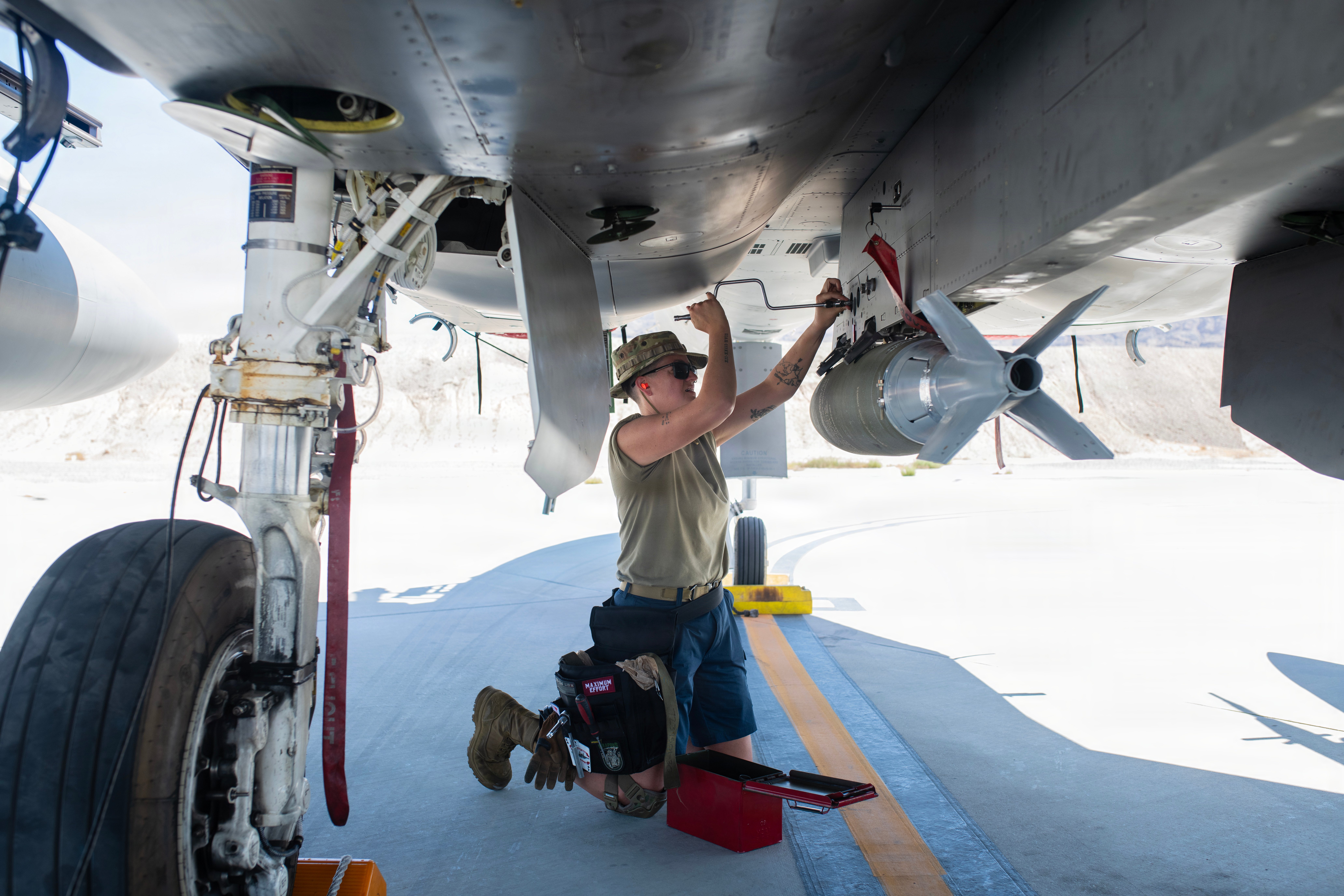 U.S. Air Force Staff Sgt. Alisha Sargent, a weapons loader assigned to the Oregon Air National Guard’s 142nd Aircraft Maintenance Squadron, loads a bomb onto an F-15EX Eagle II aircraft at Nellis Air Force Base (AFB), Nevada on August 26, 2026. The 142nd Wing operated their fleet of F-15EXs out of Nellis AFB for three weeks in late August and early September in support of the U.S. Air Force’s Weapons Instructor Course (WIC). During that time, the unit and the EX hit a historic milestone, dropping live bombs from operational F-15EXs for the first time. (U. S. Air National Guard photo by Master Sgt. Steph Sawyer)
