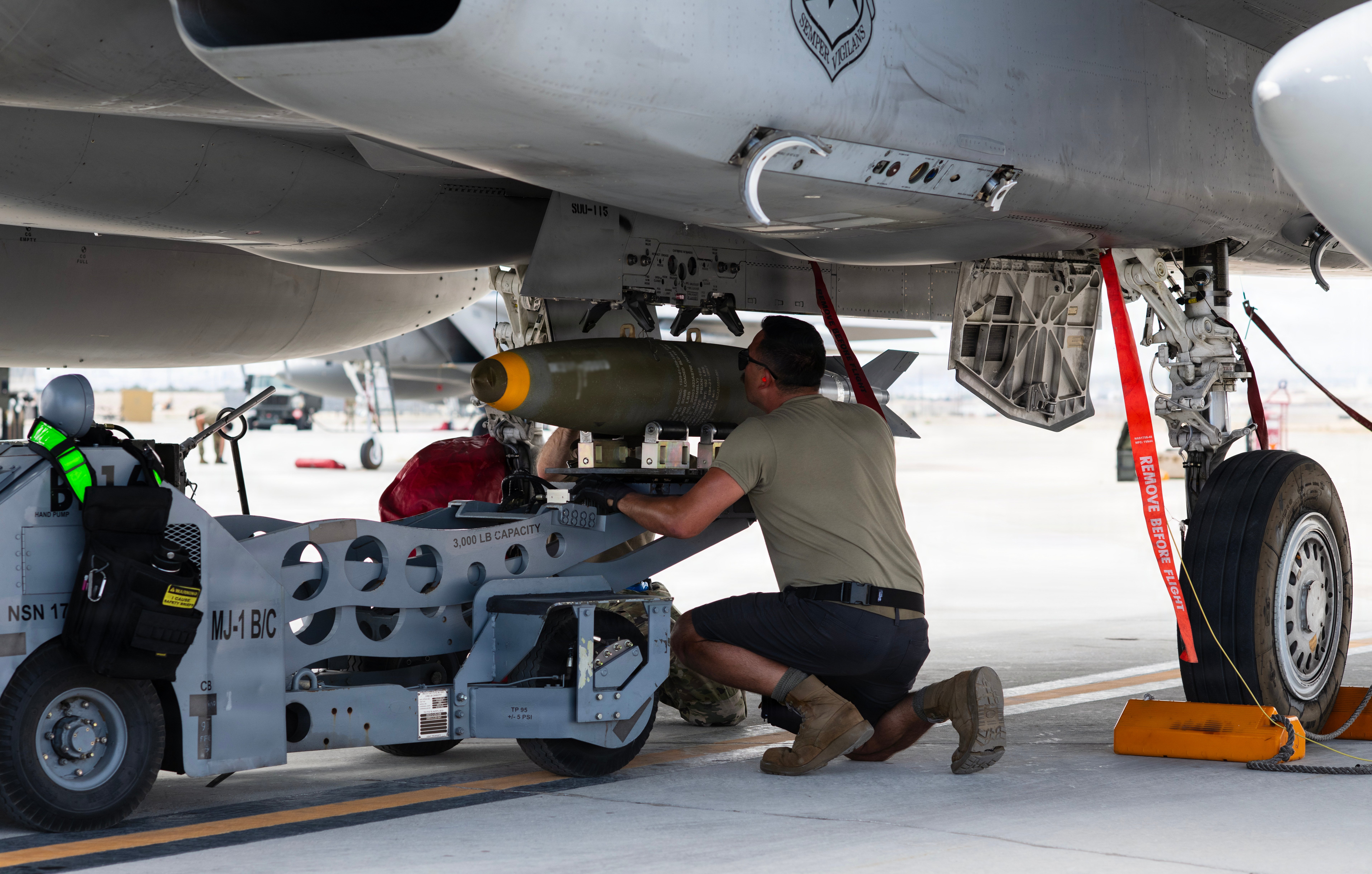 U.S. Air Force Master Sgt. Jay Aebi, non-commissioned officer in charge of weapons loading, 142nd Aircraft Maintenance Squadron, loads a bomb onto an F-15EX Eagle II aircraft at Nellis Air Force Base (AFB), Nevada on August 27, 2026. The 142nd Wing’s fleet of F-15EXs operated at Nellis AFB for three weeks in late August and early September in support of the U.S. Air Force’s Weapons Instructor Course (WIC). During this time, the unit hit a historical milestone, dropping live bombs from operational F-15EXs for the first time. (U.S. Air National Guard photo by Master Sgt. Steph Sawyer)