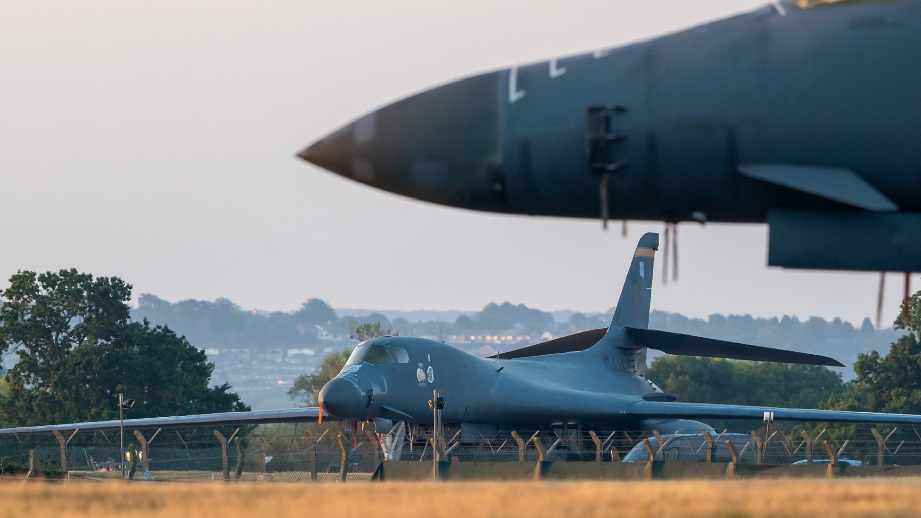 Men arrested on charges of violating British explosives act near RAF Fairford.