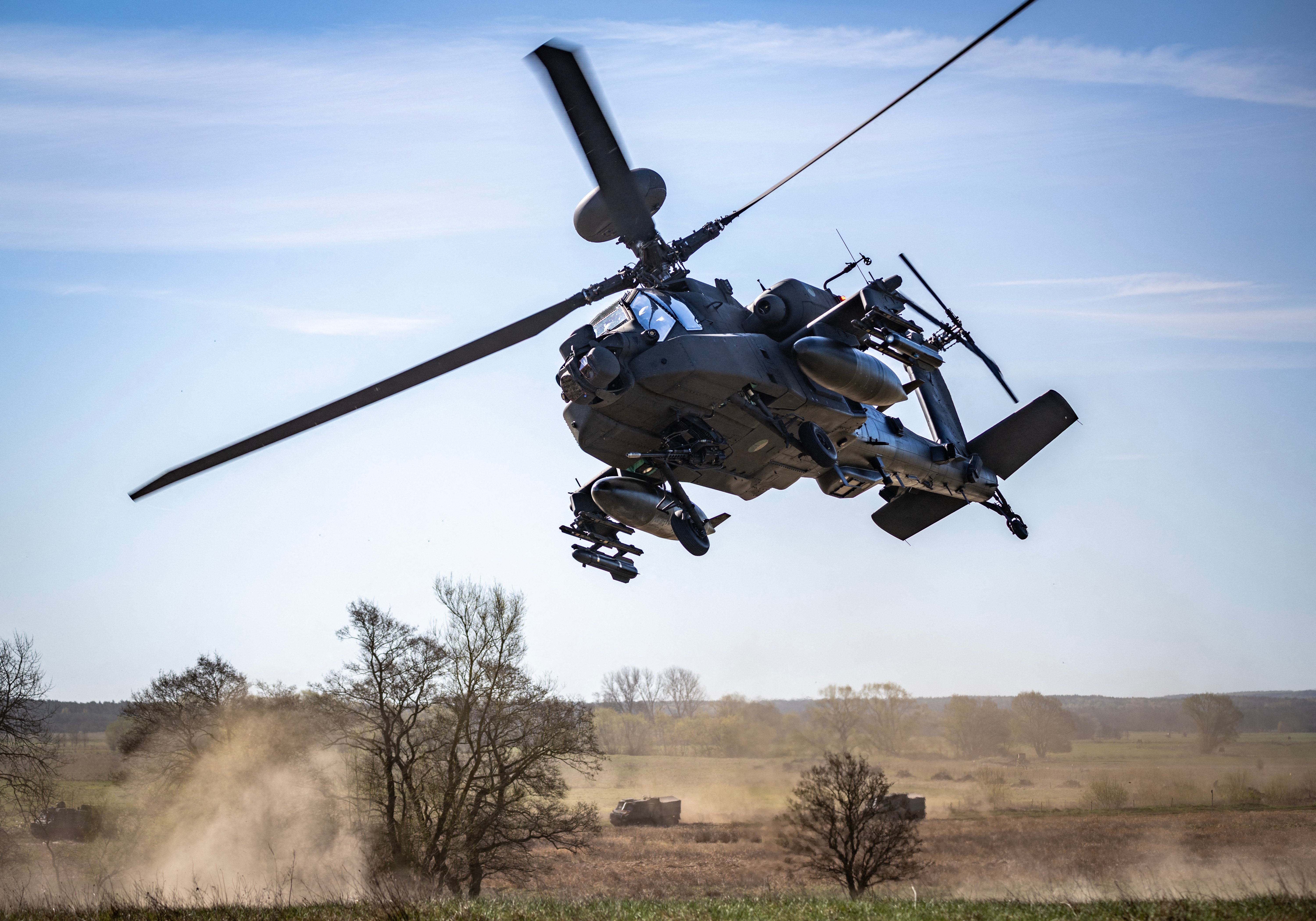 A Dutch Boeing AH-64 Apache attack helicopter takes part in a combat display during a press day for the military exercise Aurora 26 at the Revingehed training field outside Lund in Skane, Southern Sweden on April 29, 2026. The exercise at Revingehed includes personnel from several NATO countires with the focus on lessons learned from the war in Ukraine including drones. (Photo by Johan NILSSON / various sources / AFP via Getty Images) / Sweden OUT