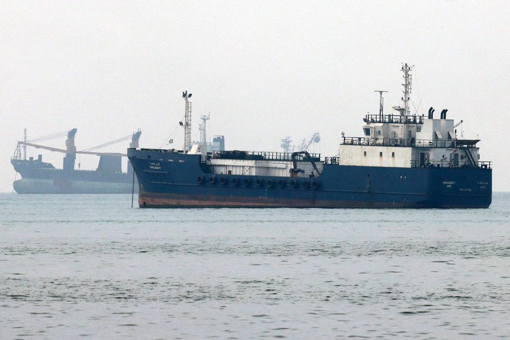 Vessels transit the Hormuz Strait off the coast of Iran's southern port city of Bandar Abbas on September 7, 2026. Iran's top negotiator threatened on September 6 of a more forceful response to any further US attacks after Tehran targeted American warships in their latest round of clashes. The exchanges of fire, which began with US raids last week, come amid a deadlock in the six-month war between the two foes. (Photo by ATTA KENARE / AFP via Getty Images) /