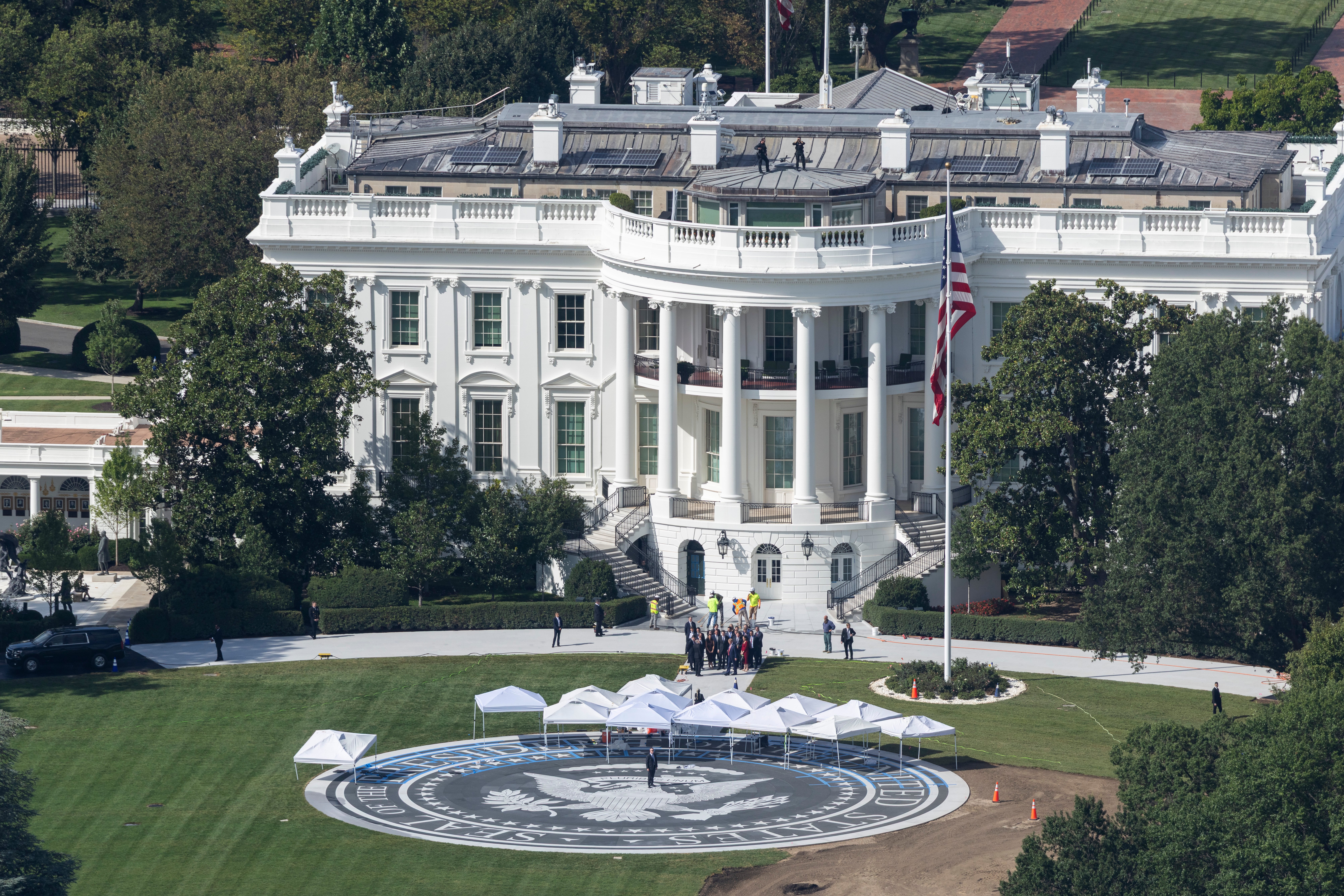  U.S. President Donald Trump leads a group of people on the south lawn of the White House on September 08, 2026 in Washington, DC. The new helipad has been under construction for the past several weeks. (Photo by Finn Gomez/Getty Images)