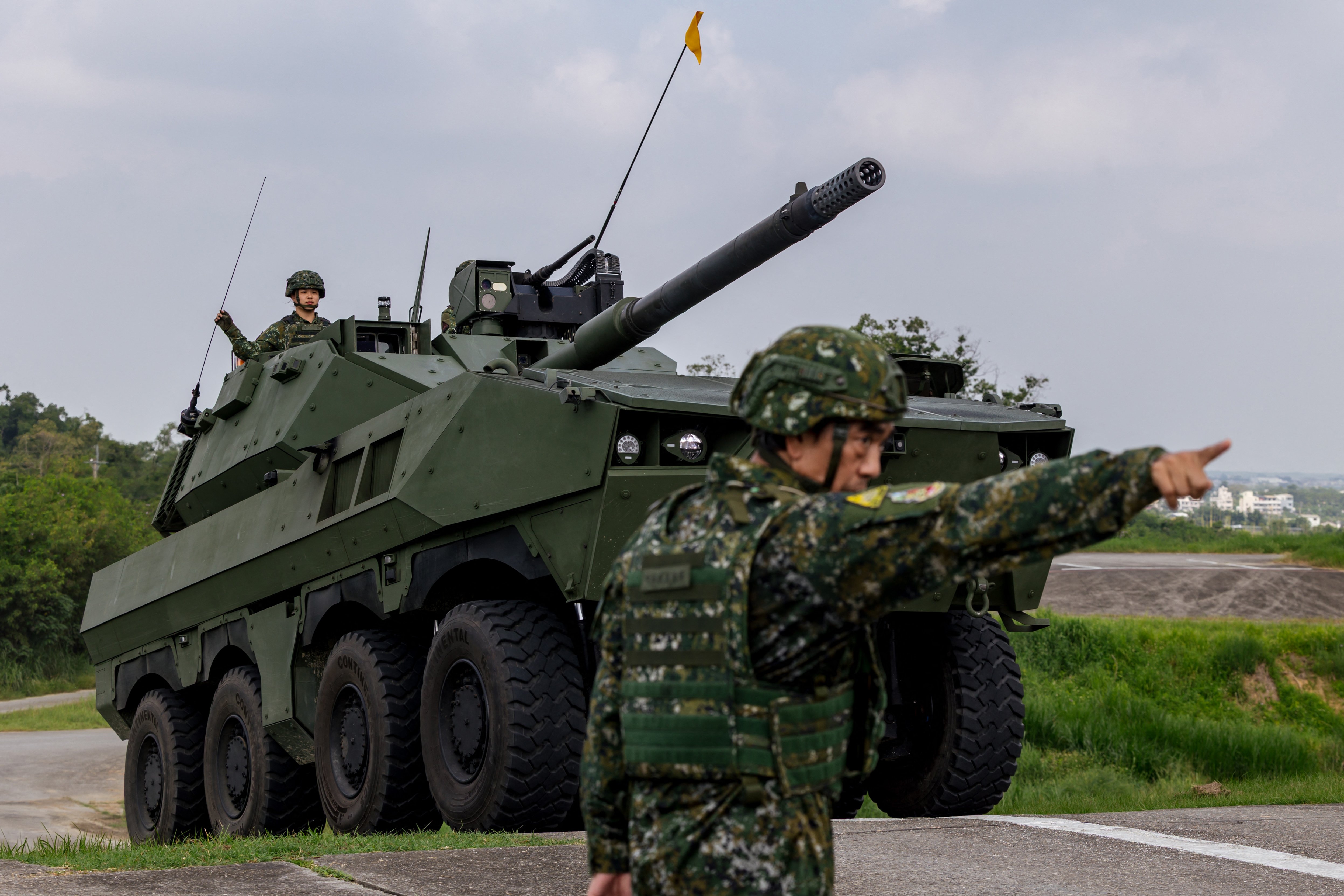 A Taiwan military 105mm wheeled armoured vehicle drives during a demonstration in Tainan on September 23, 2026. The domestically developed vehicle, equipped with a 105mm main gun, is currently undergoing operational testing and evaluation. (Photo by CHENG Yu-chen / AFP via Getty Images)