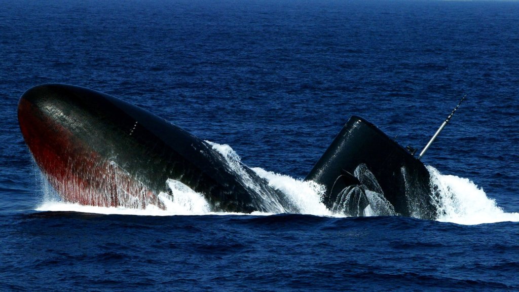 A submarine of the Japanese Maritime Defence Force surfaces during a naval review on October 26, 2003 off Sagami Bay, Japan. Prime Minister Koizumi reviewed the 52-strong fleet as well as 53 aircraft.