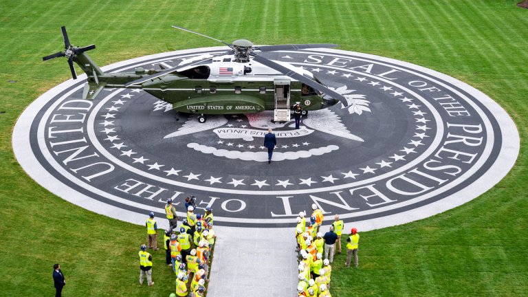 President Donald Trump formally opened the new granite helipad on the White House South Lawn on Monday, cutting a ribbon in a light drizzle before boarding Marine One for a flight to New York — the first departure from what the president has repeatedly called an essentially indestructible landing surface.