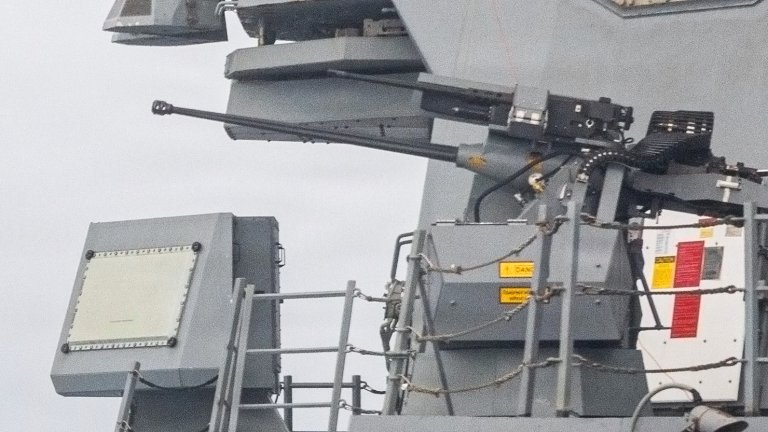 Recently released pictures have highlighted a particularly interesting feature on the U.S. Navy's Arleigh Burke class destroyer USS Mustin: a piggy-backed point defense system with a .50 caliber machine gun mounted on top of a 30mm chain gun.