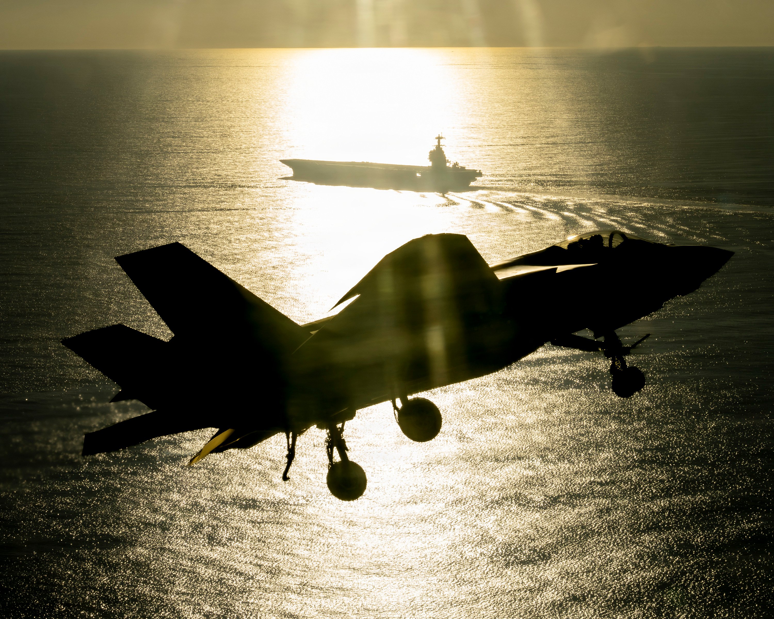 An F-35 test pilot from Air Test and Evaluation Squadron Two Three (VX-23), Naval Air Warfare Center Aircraft Division (NAWCAD), flies an F-35C Lightning II fighter aircraft to the PCU John F. Kennedy (CVN 79) in the Western Atlantic Oct. 13, 2026. This is the first time an F-35C has landed on a Ford-class aircraft carrier. A Patuxent River F-35 Integrated Test Force (ITF) team detached to the ship is conducting Aircraft Compatibility Testing (ACT) with the specially instrumented carrier variant of the stealth jet. ACT assesses the operational capabilities of the ship's aircraft launch and recovery equipment with U.S. Navy aircraft.