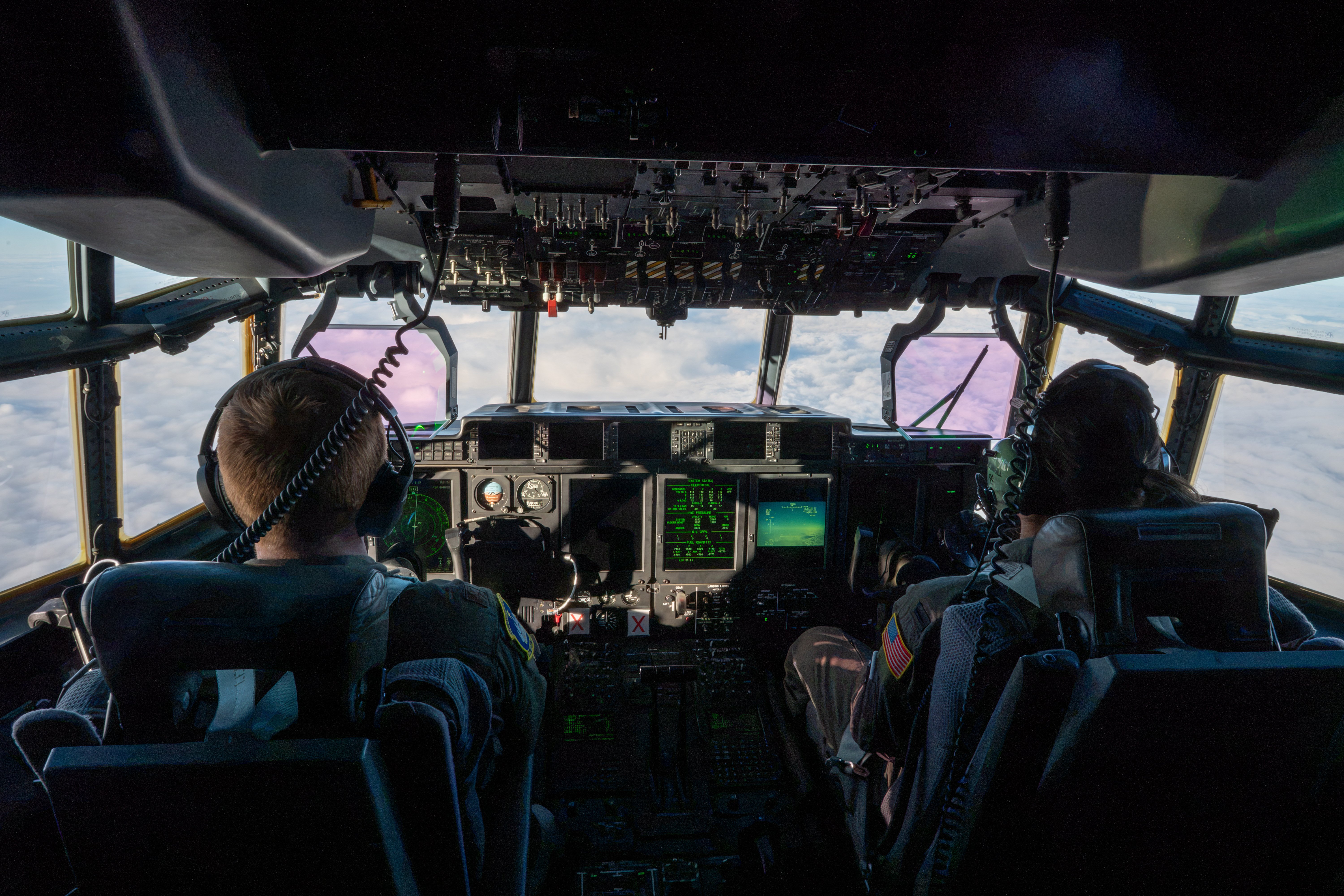U.S. Air National Guard Maj. Benjamin Van Alstine and 1st Lt. Jasmine Massingill, HC-130J Combat King II pilots assigned to the 211th Rescue Squadron, pilot an aircraft en route from Joint Base Elmendorf-Richardson to Eareckson Air Station, Alaska, during Operation NOBLE DEFENDER on Oct. 19, 2026. Operation NOBLE DEFENDER is a recurring NORAD air defense operation that demonstrates the command’s ability to defend the United States and Canada against threats from every approach. (U.S. Air Force photo by Airman 1st Class Frank Houseton)
