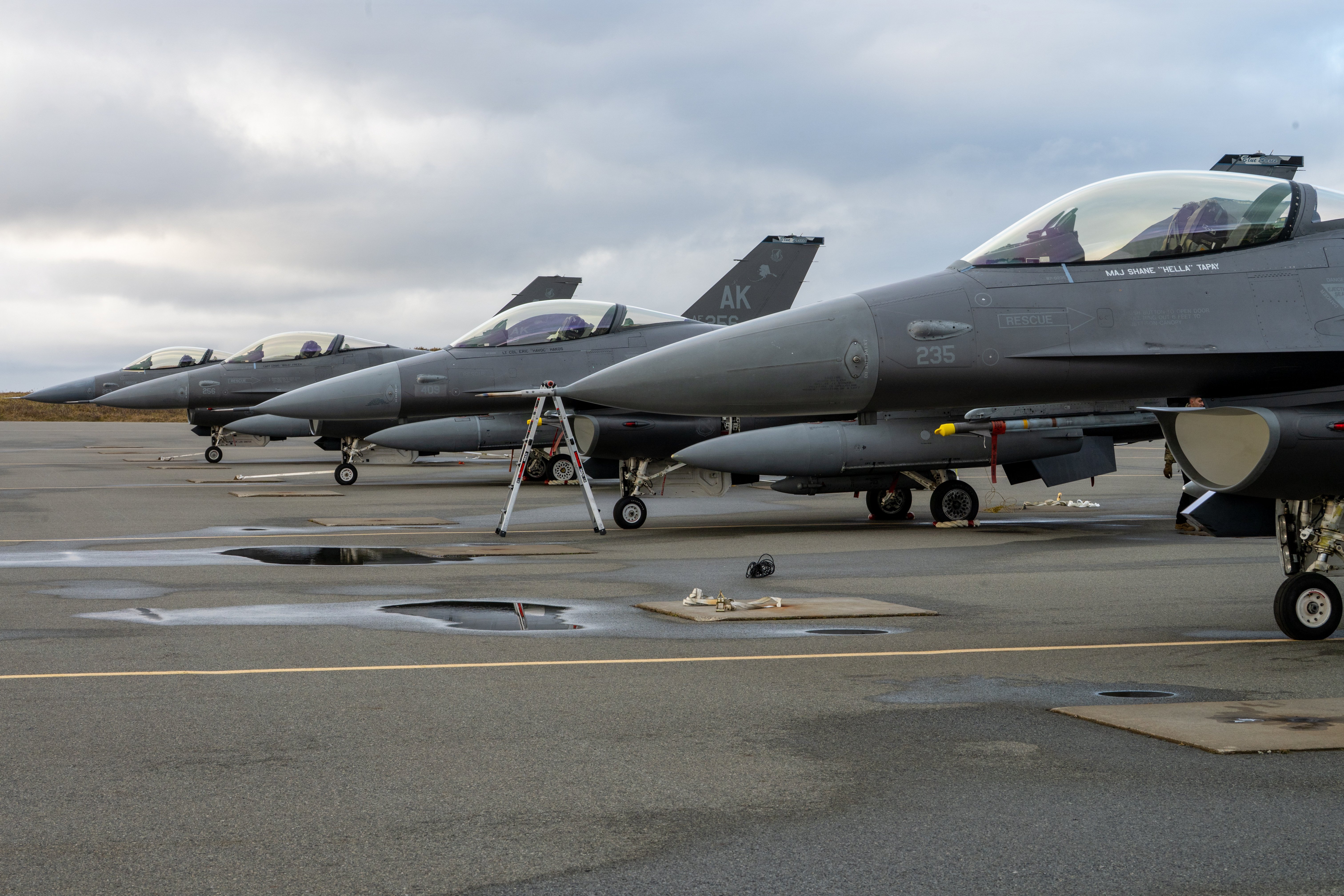 U.S. Air Force F-16 Fighting Falcons assigned to Eielson Air Force Base sit parked on the flight line at Eareckson Air Station, Alaska, during Operation NOBLE DEFENDER on Oct. 19, 2026. Staging tactical fighter aircraft at forward operating locations enhances homeland defense readiness and demonstrates rapid-deployment capabilities across remote arctic regions. (U.S. Air Force photo by Airman 1st Class Frank Houseton)