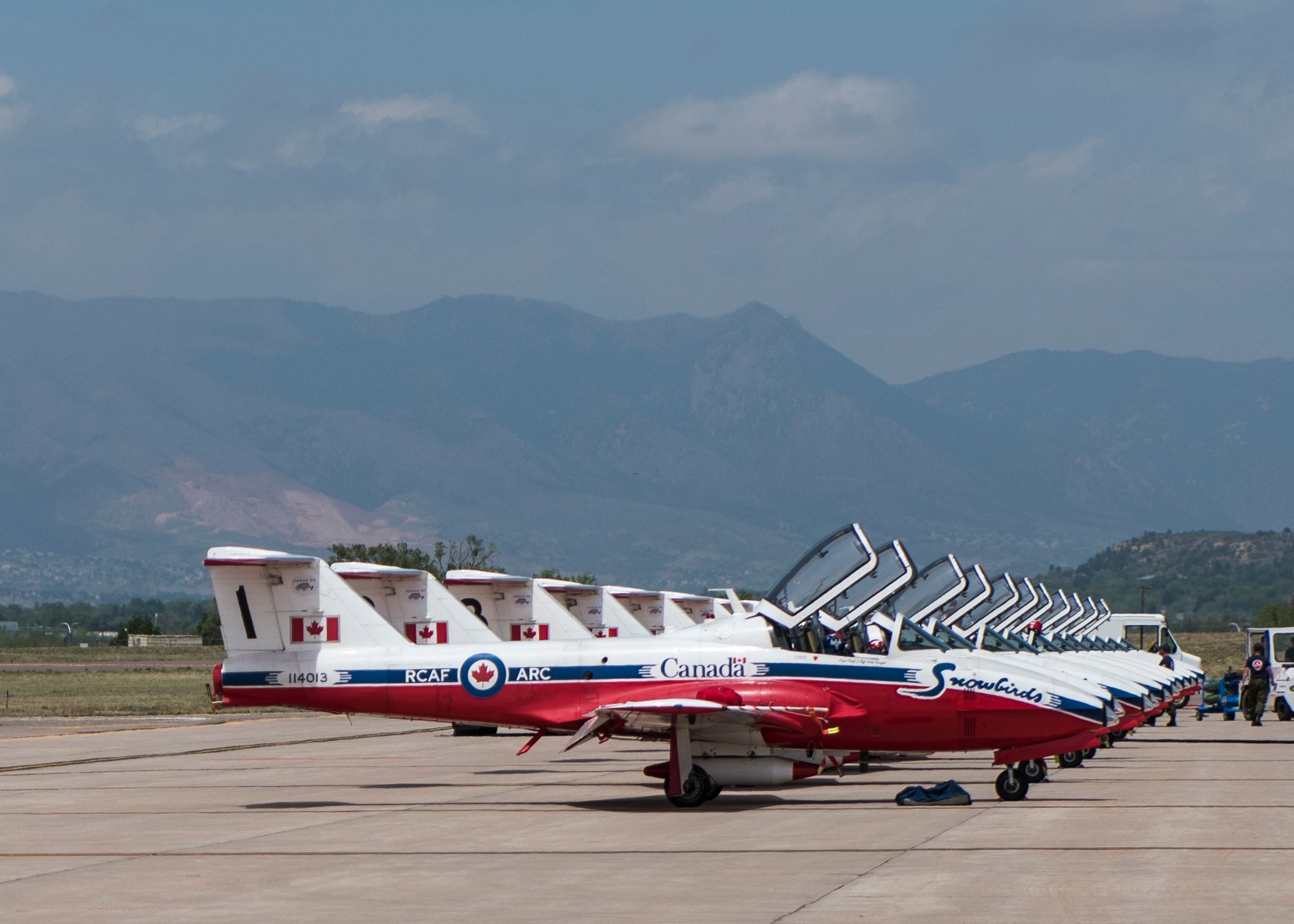 The Royal Canadian Air Force’s Snowbirds are parked on the flight line at Peterson Air Force Base, Colo., May 12, 2018. The Snowbirds aerial demonstration team performed a fly over in missing-man formation during the North American Aerospace Defense Command's 60th Anniversary Celebration. (DoD photo by Staff Sgt. Emily Kenney, USAF)