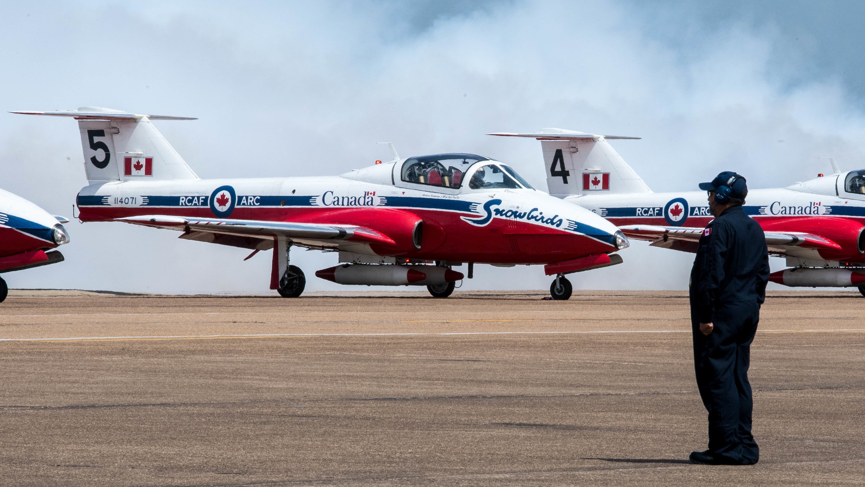 Royal Canadian Air Force CT-114 Tutor pilots with the Canadian Forces Snowbirds 431st Air Demonstration Squadron, perform pre-flight demonstrations during the Defenders of Liberty Air & Space Show at Barksdale Air Force Base, La., May 19, 2019. Serving as ambassadors of the CAF, the CF Snowbirds demonstrate a high level of skill, professionalism, teamwork, discipline and dedication inherent in the men and women of the CAF. (U.S. Air Force photo by Airman Jacob B. Wrightsman)