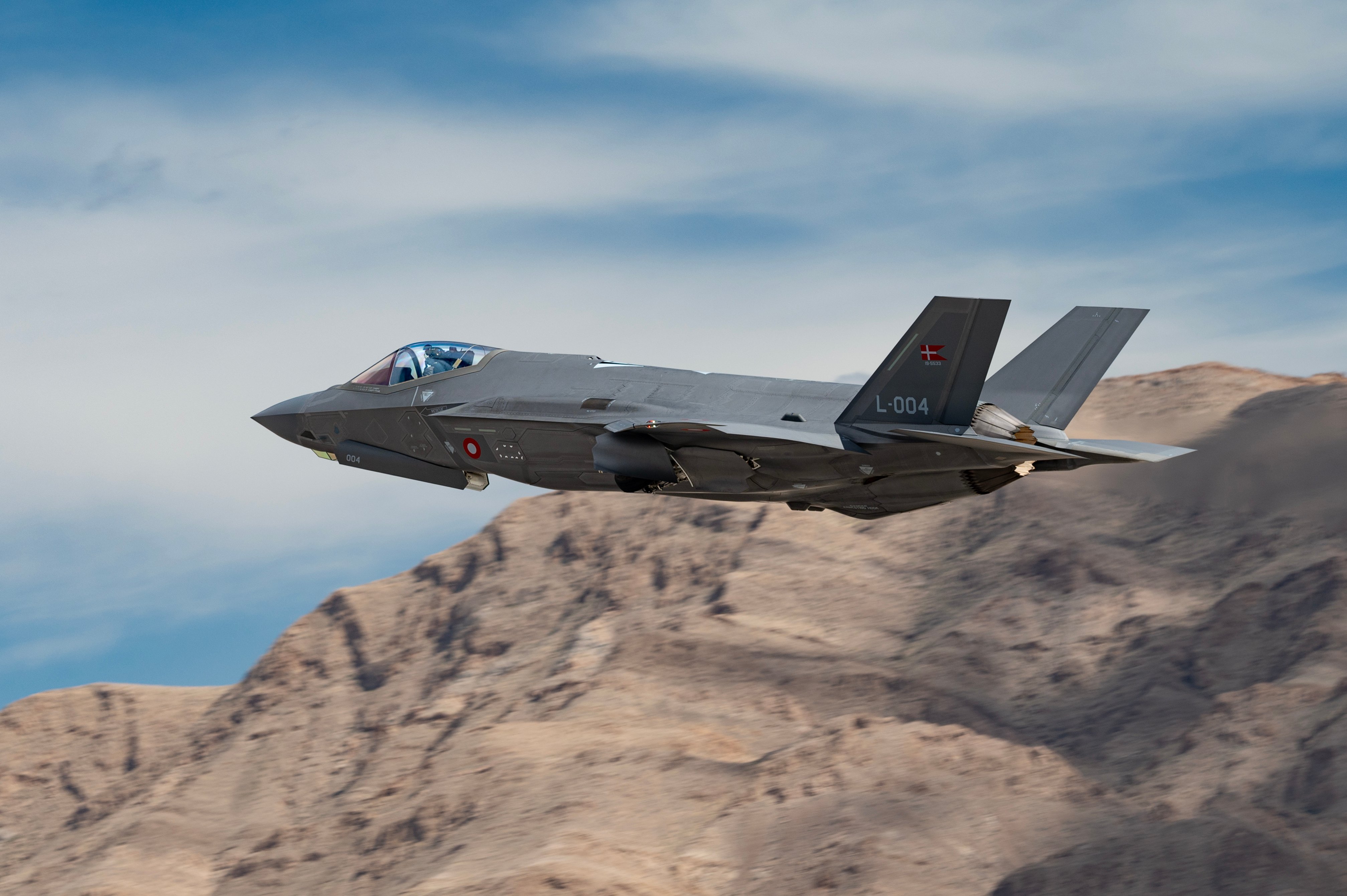 A Royal Danish Air Force F-35A from Luke Air Force Base (AFB), Arizona, takes off for Red Flag-Nellis 24-2 mission at Nellis AFB, Nevada, March 13, 2024.The integration of fifth- generation assets, such as the F-35, is a vital step towards enhancing our collective security. These advanced aircraft bring unprecedented capabilities, including enhanced stealth, sensor fusion, and network connectivity, which enable us to maintain air superiority and deter potential adversaries. (U.S. Air Force photo by William R. Lewis) RFNAFB; DoD; ACC; Air Combat Command; DoD; Ready AF; lethality; readiness; Red Flag-Nellis 24-2 Operations; Denmark; F-35; Interoperability; 5th Gen