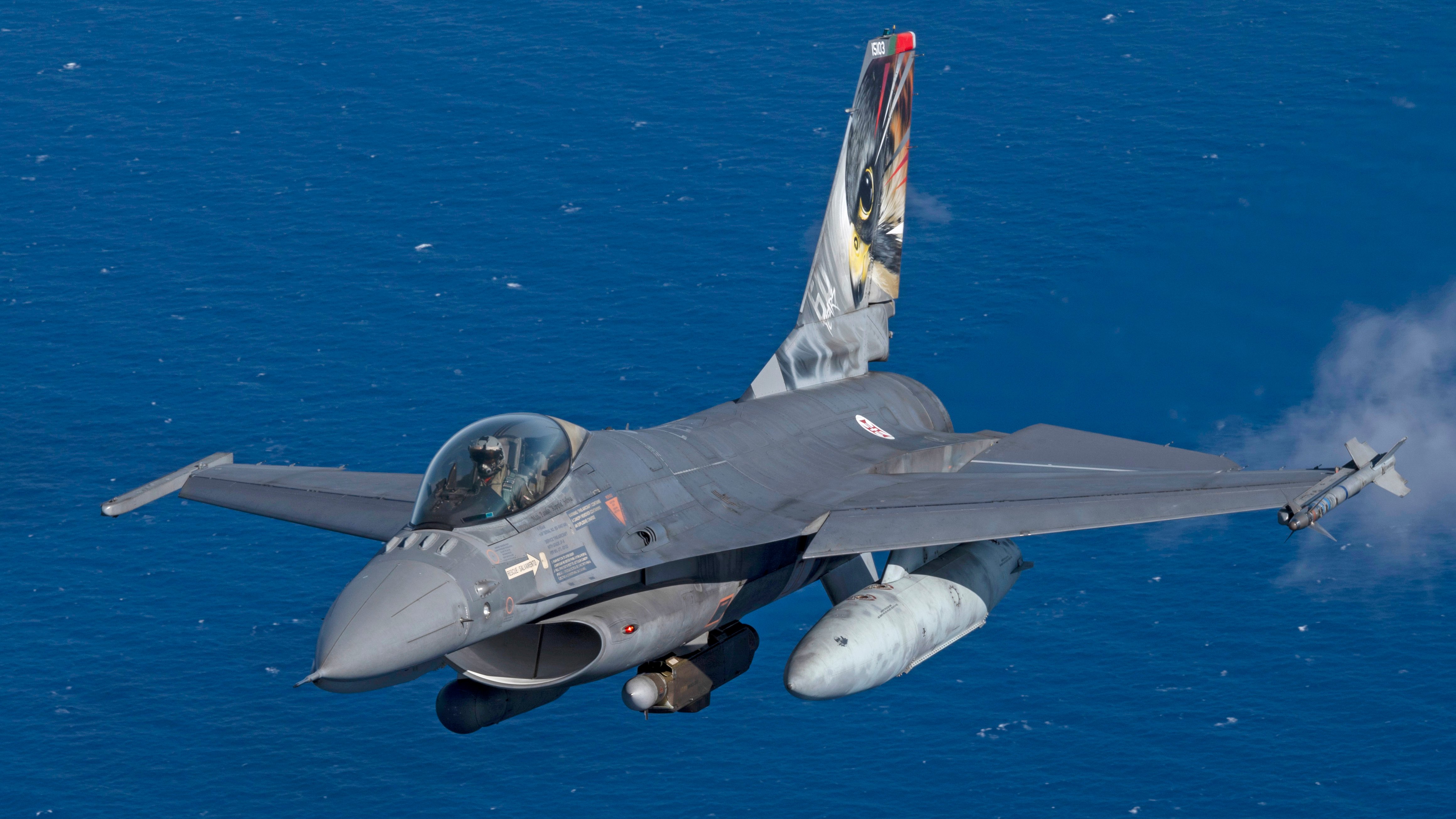 A Portuguese Air Force F-16 Fighting Falcon participating in NATO exercise Ramstein Flag 24 flies over the west coast of Greece, Oct. 4, 2024. Over 130 fighter and enabler aircraft from Greece, Canada, France, Hungary, Italy, Poland, Portugal, Romania, Spain, Sweden, United Kingdom and United States are training side by side to improve tactics and foster more robust integration, demonstrating NATO’s resolve, commitment and ability to deter potential adversaries and defend the Alliance. (U.S. Air Force photo by Tech. Sgt. Emili Koonce)