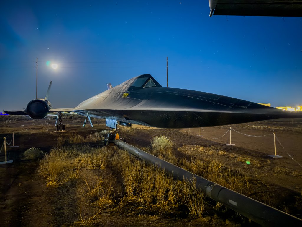 An SR-71 Blackbird basks in the evening moonlight at Edwards Air Force Base, California. The aircraft is part of the Air Force Flight Test Museum. The aircraft on display at the main museum is the 6th prototype, S/N 61-7955. Assembly started on 13 May 1964 and #955 first flew on 17 August 1965. Throughout its career, this aircraft served as the Palmdale test aircraft until being replaced by SR-71A #61-7972 in 1985. Last flown on 24 January 1985, #955 accumulated 1993.7 hours of flight time. (Air Force photo by Todd Schannuth)