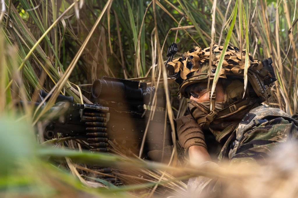 U.S. Army Soldier assigned to the 1st Battalion, 27th Infantry Regiment, 2nd Mobile Brigade, 25th Infantry Division, observes a linear danger area during the Joint Pacific Multinational Readiness Center Rotation (JPMRC) 26-01 at Schofield Barracks, Hawaii, Nov. 6, 2025. The United States Army Pacific (USARPAC) conducted Joint Pacific Multinational Readiness Center (JPMRC) Rotation 26-01 from Nov. 3 - 17, 2025, in and around the Hawaiian island chain. This exercise is designed to validate the combat readiness of the 3rd Mobile Brigade (3MBDE), 25th Infantry Division Artillery (DIVARTY), and the 125th Division Signal Battalion in a joint, multinational, multi-domain training environment. JPMRC 26-01 integrated U.S. forces, multinational partners, and joint capabilities to train tactics, techniques, and procedures required to dominate jungle and archipelagic terrain during large-scale combat operations. The exercise underscores the U.S. Army’s commitment to ensuring regional security and strengthening partnerships in the Indo-Pacific area of responsibility. (U.S. Army photo by Sgt. Duke Edwards)
