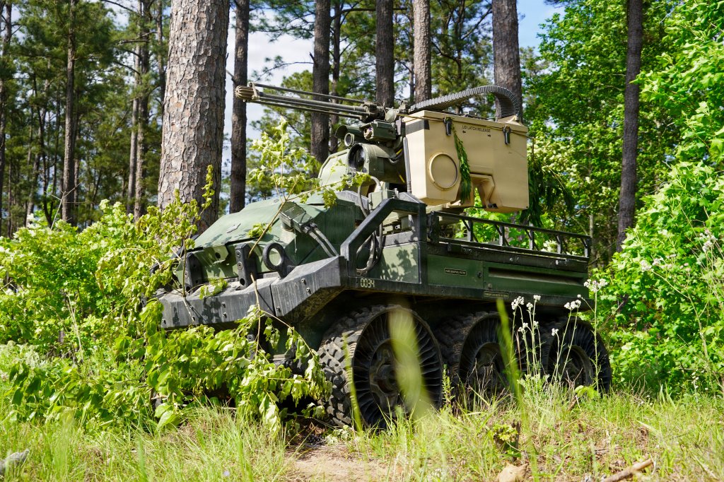 A Hunter Wolf unmanned ground vehicle assigned to Charlie Battery, 3rd Battalion, 320th Field Artillery Regiment, 3rd Mobile Brigade, 101st Airborne Division (Air Assault), holds a steady overwatch position with a mounted remote operated .50-caliber machine gun during a combat simulation exercise at the Joint Readiness Training Center, Fort Polk, Louisiana, April 13, 2026.. The Hunter Wolf platform has been selected by the U.S. Army for the Small Multipurpose Equipment Transport (S-MET) program. (U.S. Army photo by Master Sgt. Anthony Hewitt)