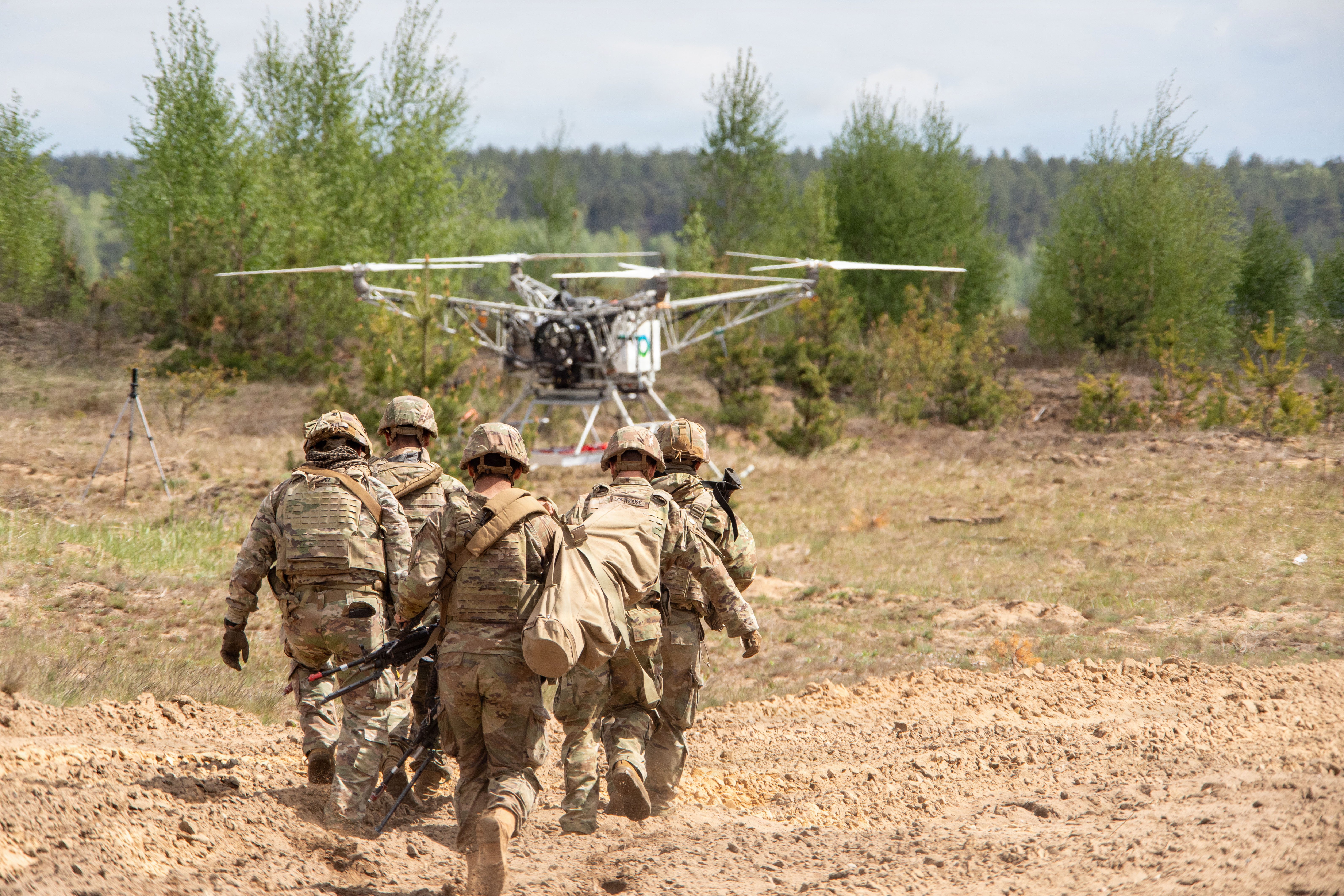 U.S. Army Soldiers assigned to the Regimental Support Squadron, 2d Cavalry Regiment, run with a test dummy in a stretcher towards a drone during an Autonomous Triage and Treatment Challenge taking place near Bemowo Piskie Training Area, Poland, May 10, 2026. From April 27 to May 31, 2026, U.S. and Allied forces will exercise the North Atlantic Treaty Organization’s (NATO) Eastern Flank Deterrence Initiative, demonstrating NATO’s ability to fight and win on the modern battlefield. Nearly 15,000 troops from eleven nations will train across the High North, Baltic region, and Poland. They will execute rapid maneuvers, air defense, counter-drone operations, and cyber defense to validate NATO’s regional defense plans in real time. This series of linked exercises includes Saber Strike, Immediate Response, and Swift Response. The exercises turn investment into capability. Soldiers integrate unmanned systems such as AI-enabled command and control and live data networks to move, decide, and fight more effectively across all domains. Sword 26 demonstrates how U.S. Army Europe and Africa drives transformation at scale while strengthening deterrence. Together with our allies, we are building a unified, lethal force ready to defend NATO territory and respond to any threat. (U.S. Army Reserve photo by Spc. Thomas Madrzak)