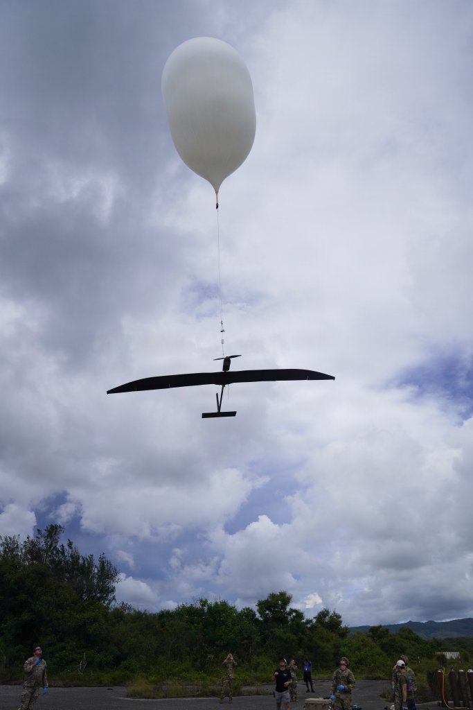 U.S. Army Soldiers assigned to the Extended Range Sensing and Effects Company, 3d Multi-Domain Effects Battalion, 3d Multi-Domain Task Force, and industry partners attach an Icarus Apollo R stratospheric fixed wing aircraft to an Urban Sky high-altitude balloon during a multi-day Special User Demonstration at Orote Airfield on Naval Station Guam, June 24, 2026, for Valiant Shield 26. The joint team conducted the pre-launch configuration to test stratospheric sensor capabilities and joint extended communication networks, directly advancing our capacity to develop and validate Combined Joint All-Domain Command and Control concepts forward in the theater. This staging operation was conducted in support of Valiant Shield 2026. Exercises like Valiant Shield allow Pacific Command Joint Forces the opportunity to integrate forces from all branches of service and with our allies to conduct precise, lethal, and overwhelming multi-axis, multi-domain effects that demonstrate the strength and versatility of the joint force and our commitment to a free and open Indo-Pacific. (U.S. Army photo by Sgt. 1st Class Ondirae Hamil Abdullah-Robinson)