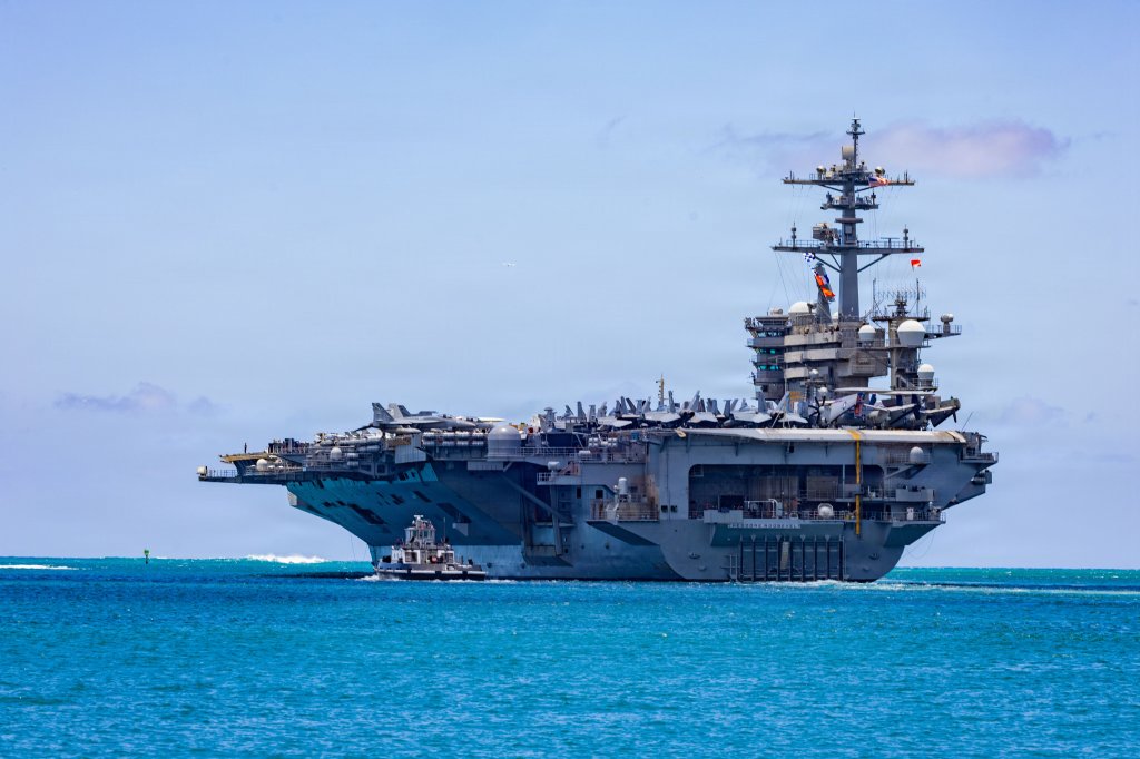 Nimitz-class aircraft carrier USS Theodore Roosevelt (CVN 71) departs Joint Base Pearl Harbor-Hickam, Hawaii, during Exercise Rim of the Pacific 2026, July 7, 2026. Thirty nations, over 30 surface ships, five submarines, 15 national land forces, more than 206 aircraft and 30,000 personnel are participating in RIMPAC in and around the Hawaiian Islands, June 24 to July 31. The world's largest international maritime exercise, RIMPAC provides a unique training opportunity while fostering and sustaining cooperative relationships among participants critical to ensuring the safety of sea lanes and security on the world's oceans. RIMPAC 2026 is the 30th exercise in the series that began in 1971. (U.S. Navy photo by Mass Communications Specialist First Class Luke McCall)