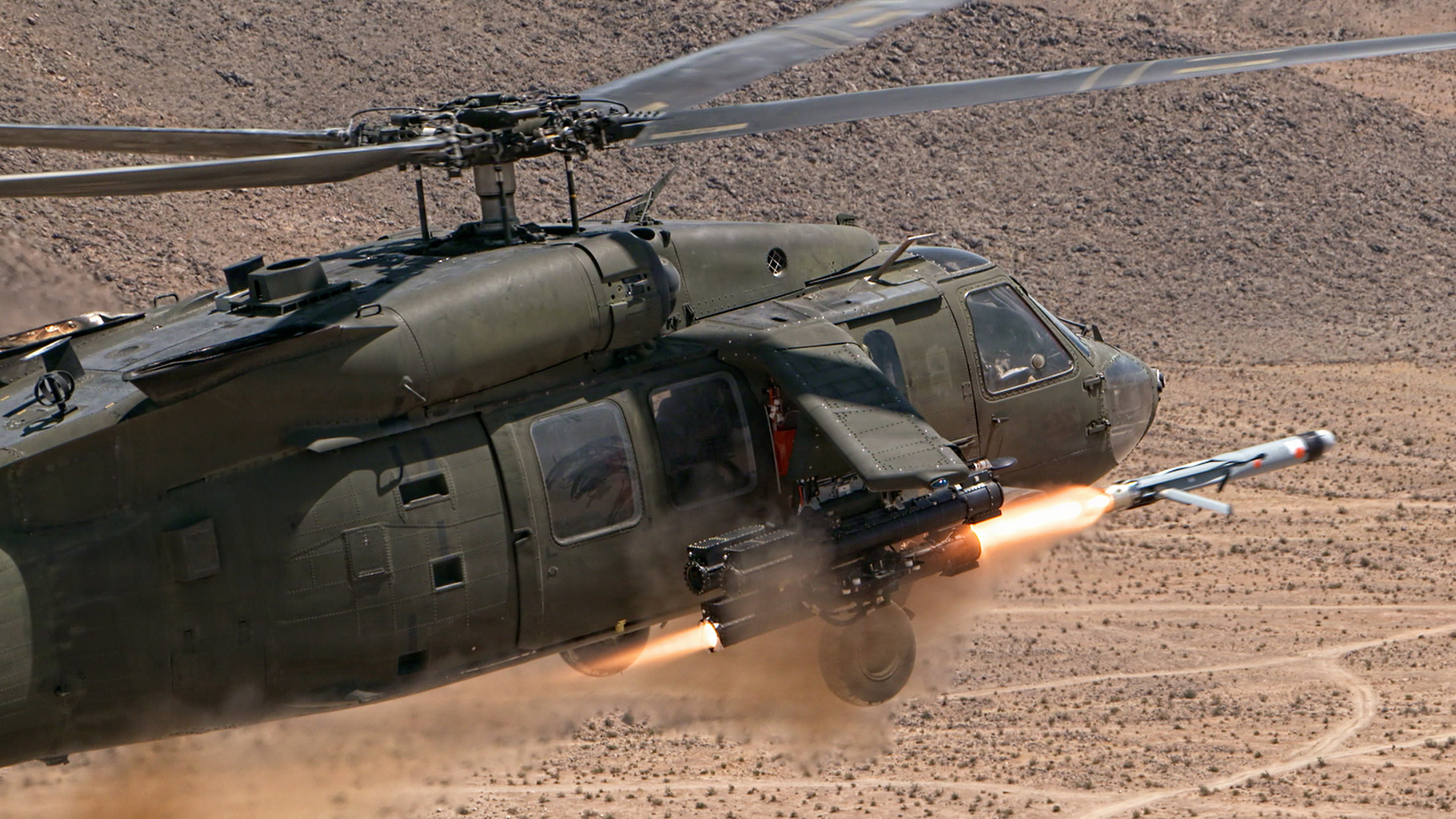 A Launched Effect-Medium Range is fired from a UH-60M Blackhawk helicopter, utilizing the platform-agnostic government-developed Launched Effects Dispenser for Ground and Rotorcraft (LEDGR) during Project Convergence-Capstone 6 at Fort Irwin, California, July 20, 2026. LEDGR enables airborne rotorcraft to extend the operational reach, survivability, and mission-tailored lethality of maneuver forces. (U.S. Army photo by Staff Sgt. Dane Howard)