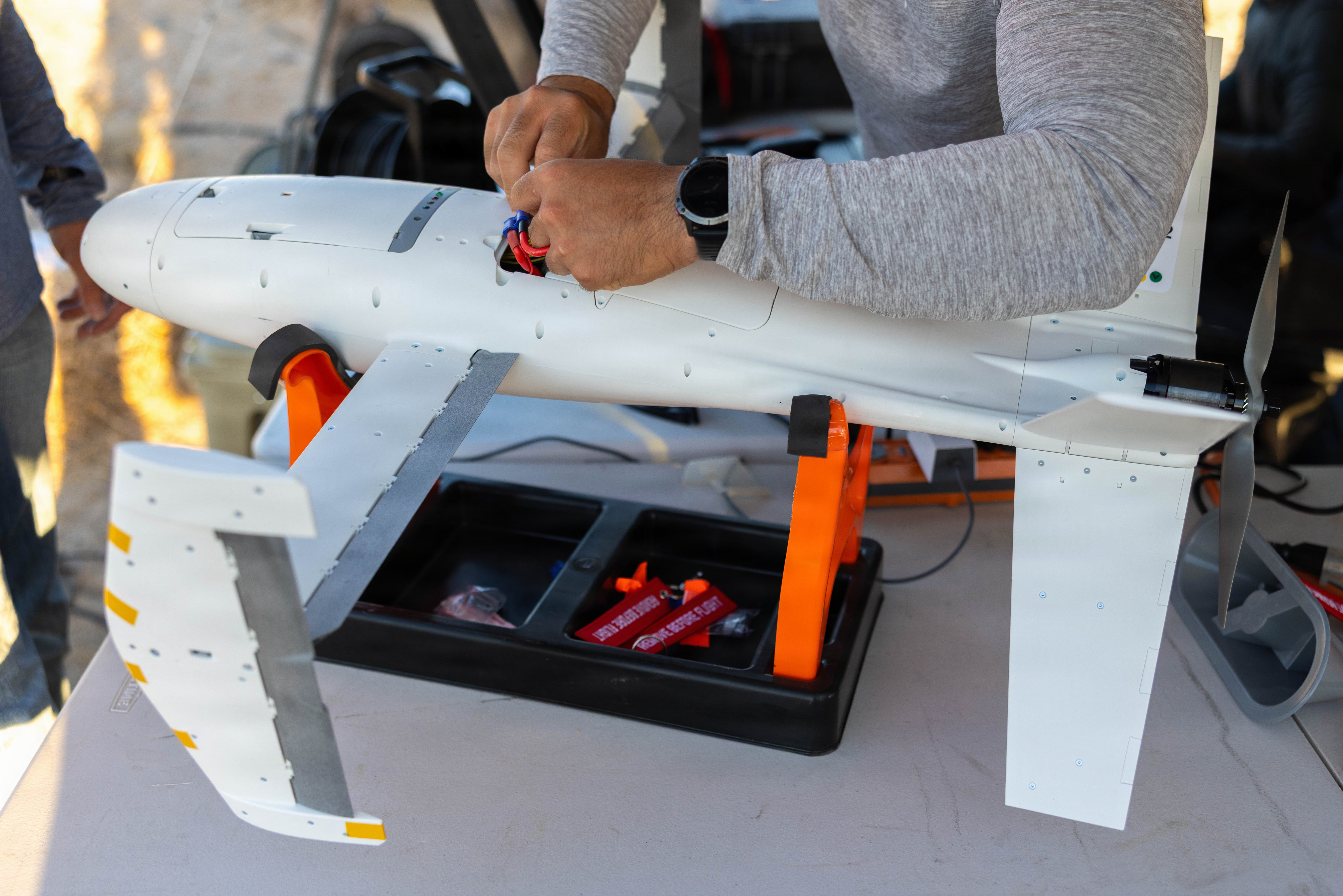 A Merops drone is prepared for flight during a Perennial Autonomy drone demo on Range 220 as part of Service Level Training Exercise 4-26 on Marine Corps Air Ground Combat Center, Twentynine Palms, California, July 28, 2026. SLTE 4-26 is designed to be a challenging, realistic training environment that produces combat-ready forces capable of operating as an integrated Marine Air Ground Task Force across all domains of military operations. (U.S. Marine Corps photo by Lance Cpl. Carla Perez Ramirez)