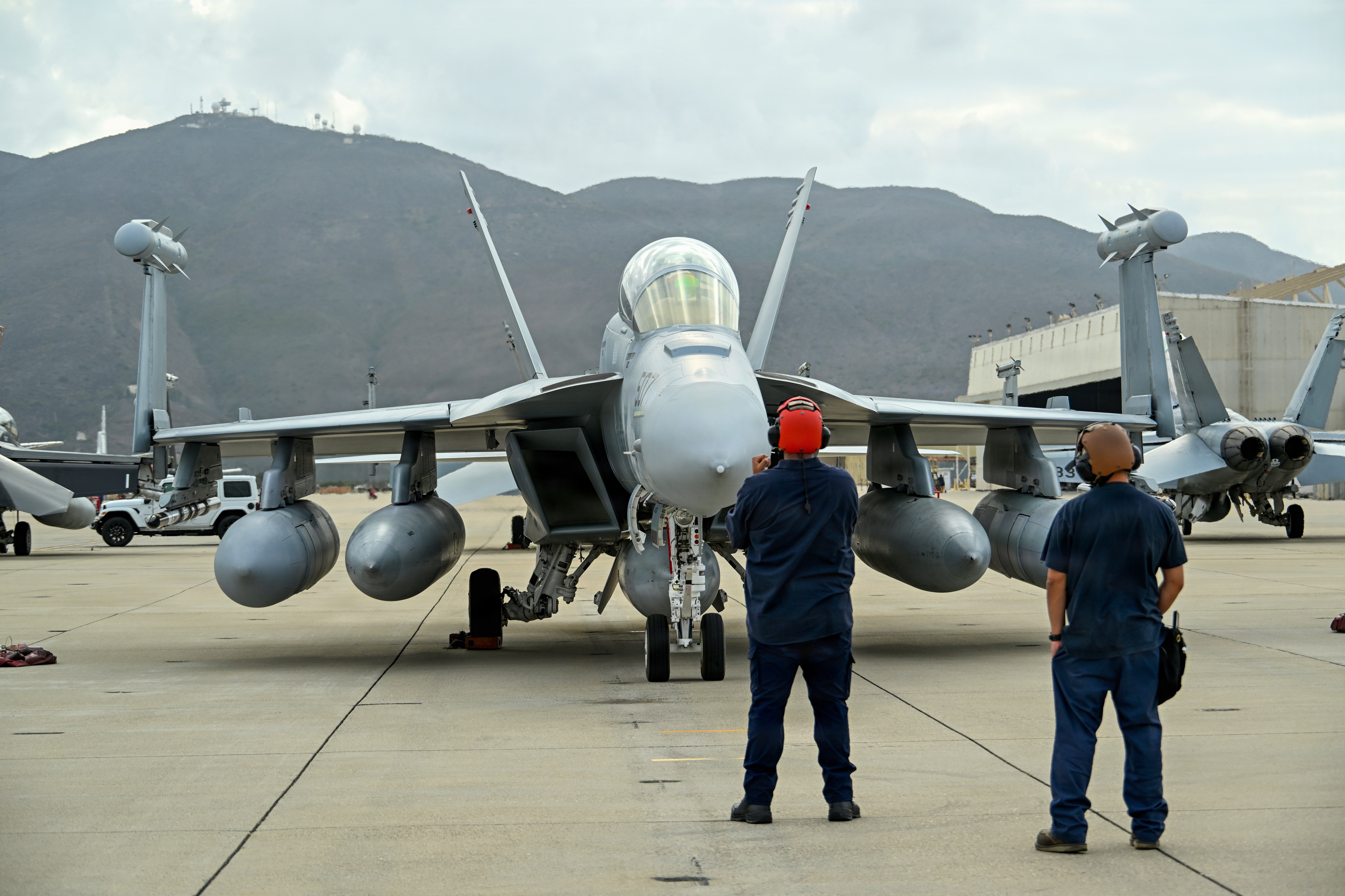 Ground crew members stand by an EA-18G Growler on the flight line at Naval Base Ventura County Point Mugu, Sept. 30, 2026. Gray Flag is the naval aviation test community’s premier large-force test event, providing unique venues for large-scale integration of new capabilities across services and platforms. Working with the Joint Force, industry and our nation’s allies to ensure integration and interoperability is key to ensuring warfighters have a decisive advantage in the field. (U.S. Navy photo by Katie Archibald)
