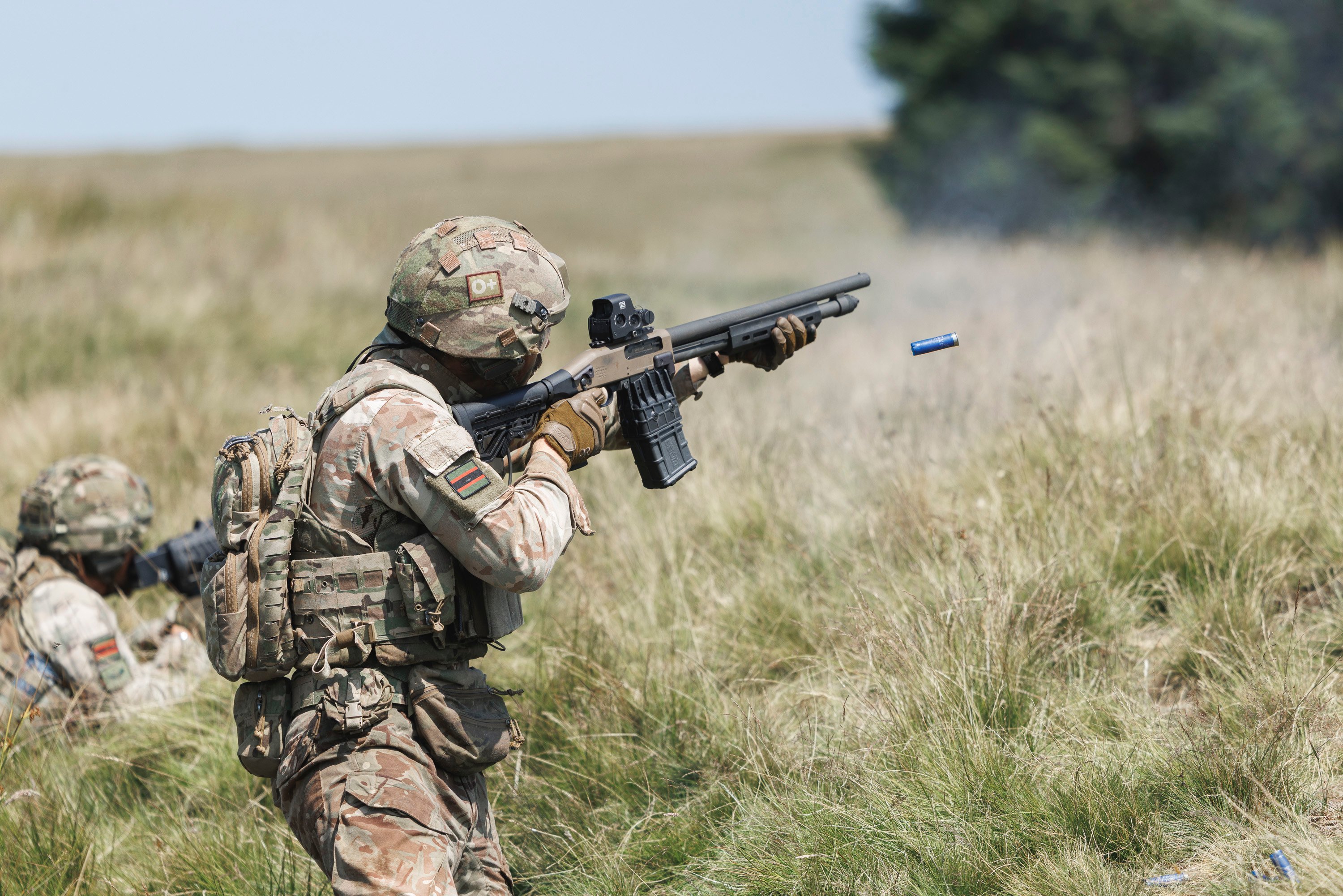 IMAGE: Riflemen from 1st Battalion The Rifles testing the Mossberg 590M Counter SUAS shotgun (foreground) and handheld Counter-Unmanned Aerial System effectors against drones in Sennybridge Training Area (SENTA). On Friday 10 July 2026, Soldiers from 1st Battalion The Rifles conducted an experimental Counter-Unmanned Aerial System (C-UAS) Advanced Combat Marksmanship Test (ACMT) on Sennybridge. The exercise focussed on the preparation of troops to counter emerging aerial threats effectively, also testing new ammunition types with integrated support from various specialist UAS teams. In addition, there was close-range engagement of First-Person View (FPV) drones using shotguns, requiring hits on three out of five targets at 25 metres.