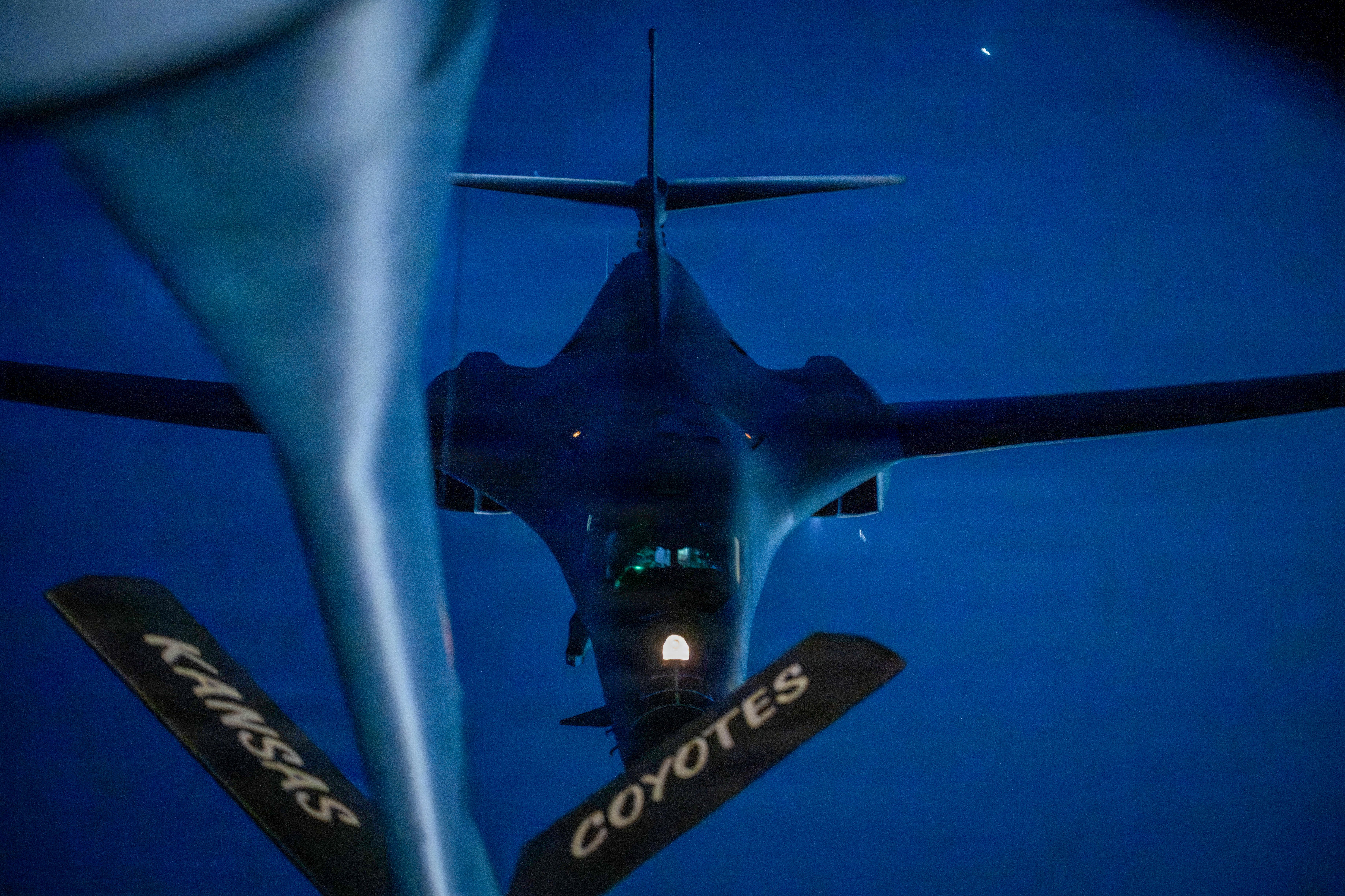 A U.S. Air Force B-1B Lancer aerial refuels with a U.S. Air Force KC-135 Stratotanker while on a night-time mission during Operation Epic Fury. (U.S. Air Force photo)