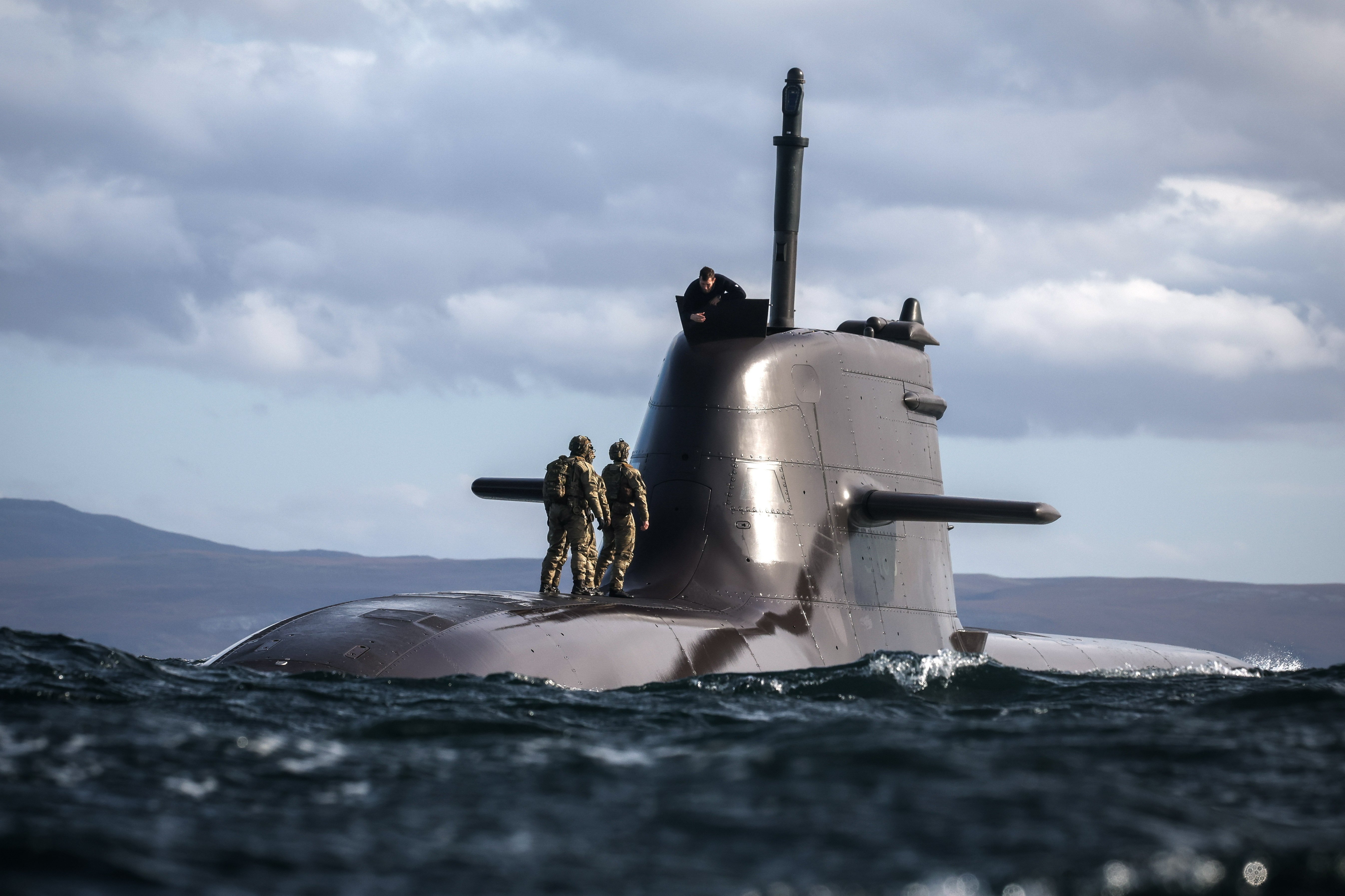 29 Sep 2026 – Meiktila Commandos board German U-Boat off the North coast of Scotland during Strike Warrior 26. 148 (Meiktila) Commando Forward Observation Battery has conducted a Full Mission Profile (FMP), integrating a German Navy submarine and Portuguese warship during Exercise Strike Warrior 26. The serial was designed to rehearse a submarine link-up and develop the Battery’s maritime integration, including float-on/float-off drills with 148’s boats. The force subsequently conducted a submarine infiltration and discreet small-boat insertion towards the target area. The FMP culminated in the establishment of an Observation Post (OP), from which the team coordinated live Naval Surface Fires from the Portuguese warship, resulting in a successful engagement and extraction. The serial demonstrated the capability of NATO partners to integrate specialist assets and coordinate complex activity across the maritime and land domains. The submarine provided Intelligence, Surveillance and Reconnaissance (ISR) support to identify and develop the target, before deploying Special Observation Teams to conduct a tactical beach landing and establish a hasty OP. The Portuguese warship subsequently delivered live Naval Surface Fires against the designated target. “This level of complexity and coordination of live assets has not been achieved by 148 for nearly 30 years. We wanted to demonstrate to our partners across the United Kingdom Commando Force, wider UK Defence and NATO SOF community the type of missions we are prepared to execute against future threats. Warfighting is our focus, and we are prepared to employ specialist assets to deliver Multi-Domain Fires and Targeting.” - Operations Officer, 148 (Meiktila) Commando Forward Observation Battery, Royal Artillery. The UK Commando Force are taking part in their largest collective workout in 15 years to demonstrate their ability to safeguard the country – and its allies – against a myriad of threats.