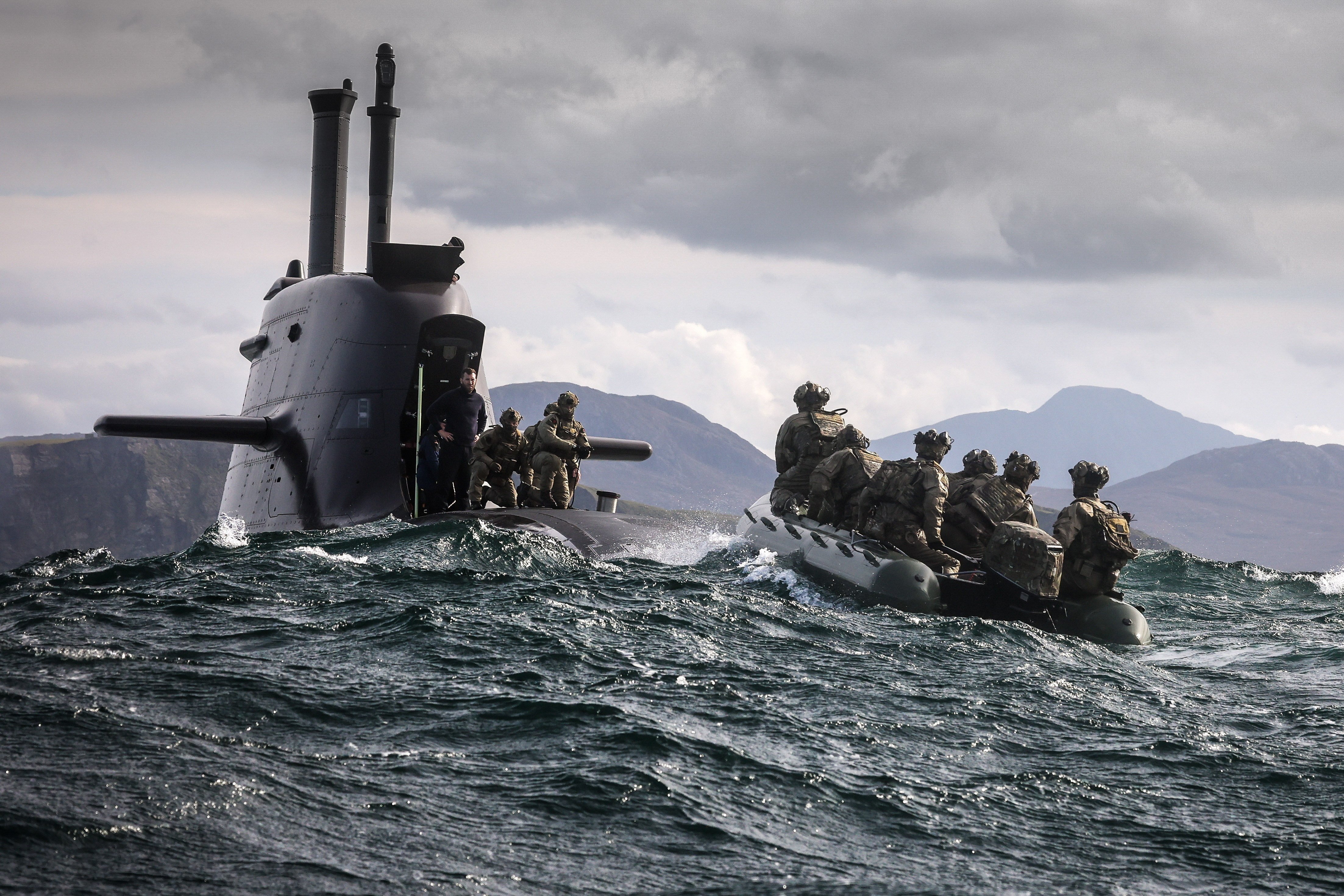 29 Sep 2026 – Meiktila Commandos board German U-Boat off the North coast of Scotland during Strike Warrior 26. 148 (Meiktila) Commando Forward Observation Battery has conducted a Full Mission Profile (FMP), integrating a German Navy submarine and Portuguese warship during Exercise Strike Warrior 26. The serial was designed to rehearse a submarine link-up and develop the Battery’s maritime integration, including float-on/float-off drills with 148’s boats. The force subsequently conducted a submarine infiltration and discreet small-boat insertion towards the target area. The FMP culminated in the establishment of an Observation Post (OP), from which the team coordinated live Naval Surface Fires from the Portuguese warship, resulting in a successful engagement and extraction. The serial demonstrated the capability of NATO partners to integrate specialist assets and coordinate complex activity across the maritime and land domains. The submarine provided Intelligence, Surveillance and Reconnaissance (ISR) support to identify and develop the target, before deploying Special Observation Teams to conduct a tactical beach landing and establish a hasty OP. The Portuguese warship subsequently delivered live Naval Surface Fires against the designated target. “This level of complexity and coordination of live assets has not been achieved by 148 for nearly 30 years. We wanted to demonstrate to our partners across the United Kingdom Commando Force, wider UK Defence and NATO SOF community the type of missions we are prepared to execute against future threats. Warfighting is our focus, and we are prepared to employ specialist assets to deliver Multi-Domain Fires and Targeting.” - Operations Officer, 148 (Meiktila) Commando Forward Observation Battery, Royal Artillery. The UK Commando Force are taking part in their largest collective workout in 15 years to demonstrate their ability to safeguard the country – and its allies – against a myriad of threats.