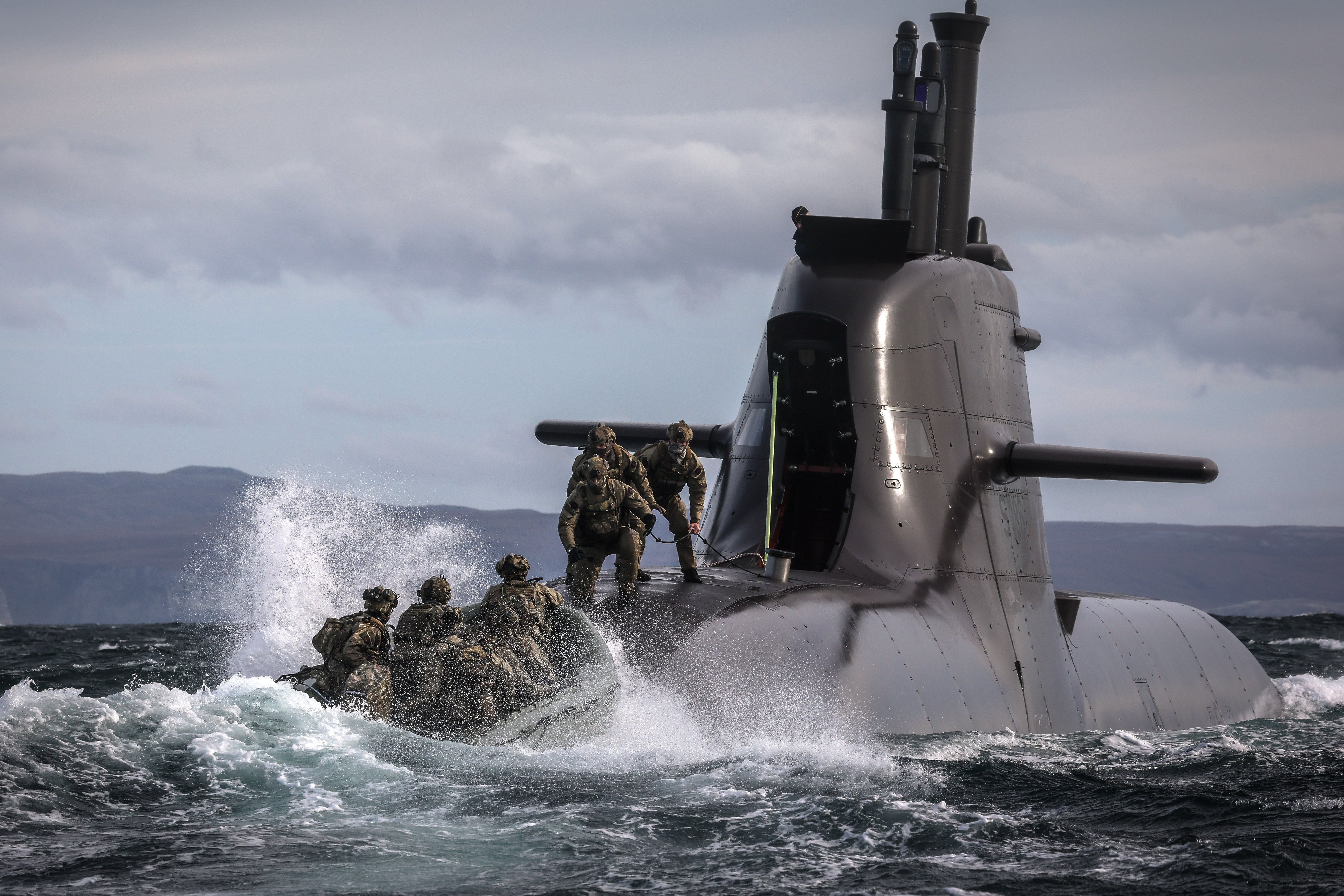29 Sep 2026 – Meiktila Commandos board German U-Boat off the North coast of Scotland during Strike Warrior 26. 148 (Meiktila) Commando Forward Observation Battery has conducted a Full Mission Profile (FMP), integrating a German Navy submarine and Portuguese warship during Exercise Strike Warrior 26. The serial was designed to rehearse a submarine link-up and develop the Battery’s maritime integration, including float-on/float-off drills with 148’s boats. The force subsequently conducted a submarine infiltration and discreet small-boat insertion towards the target area. The FMP culminated in the establishment of an Observation Post (OP), from which the team coordinated live Naval Surface Fires from the Portuguese warship, resulting in a successful engagement and extraction. The serial demonstrated the capability of NATO partners to integrate specialist assets and coordinate complex activity across the maritime and land domains. The submarine provided Intelligence, Surveillance and Reconnaissance (ISR) support to identify and develop the target, before deploying Special Observation Teams to conduct a tactical beach landing and establish a hasty OP. The Portuguese warship subsequently delivered live Naval Surface Fires against the designated target. “This level of complexity and coordination of live assets has not been achieved by 148 for nearly 30 years. We wanted to demonstrate to our partners across the United Kingdom Commando Force, wider UK Defence and NATO SOF community the type of missions we are prepared to execute against future threats. Warfighting is our focus, and we are prepared to employ specialist assets to deliver Multi-Domain Fires and Targeting.” - Operations Officer, 148 (Meiktila) Commando Forward Observation Battery, Royal Artillery. The UK Commando Force are taking part in their largest collective workout in 15 years to demonstrate their ability to safeguard the country – and its allies – against a myriad of threats.