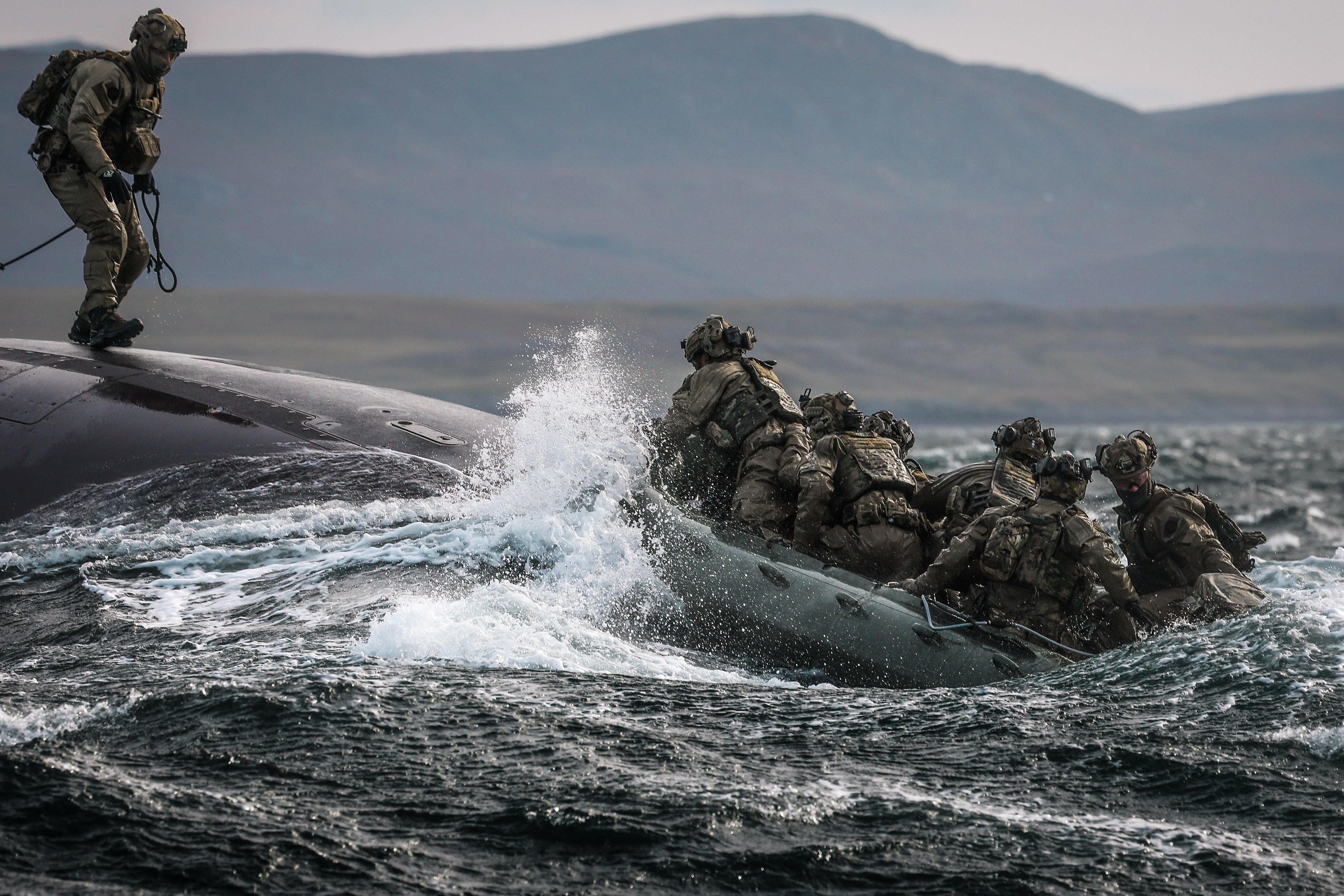 29 Sep 2026 – Meiktila Commandos board U-Boat off the North coast of Scotland during Strike Warrior 26. 148 (Meiktila) Commando Forward Observation Battery has conducted a Full Mission Profile (FMP), integrating a German Navy submarine and Portuguese warship during Exercise Strike Warrior 26. The serial was designed to rehearse a submarine link-up and develop the Battery’s maritime integration, including float-on/float-off drills with 148’s boats. The force subsequently conducted a submarine infiltration and discreet small-boat insertion towards the target area. The FMP culminated in the establishment of an Observation Post (OP), from which the team coordinated live Naval Surface Fires from the Portuguese warship, resulting in a successful engagement and extraction. The serial demonstrated the capability of NATO partners to integrate specialist assets and coordinate complex activity across the maritime and land domains. The submarine provided Intelligence, Surveillance and Reconnaissance (ISR) support to identify and develop the target, before deploying Special Observation Teams to conduct a tactical beach landing and establish a hasty OP. The Portuguese warship subsequently delivered live Naval Surface Fires against the designated target. “This level of complexity and coordination of live assets has not been achieved by 148 for nearly 30 years. We wanted to demonstrate to our partners across the United Kingdom Commando Force, wider UK Defence and NATO SOF community the type of missions we are prepared to execute against future threats. Warfighting is our focus, and we are prepared to employ specialist assets to deliver Multi-Domain Fires and Targeting.” - Operations Officer, 148 (Meiktila) Commando Forward Observation Battery, Royal Artillery. The UK Commando Force are taking part in their largest collective workout in 15 years to demonstrate their ability to safeguard the country – and its allies – against a myriad of threats.