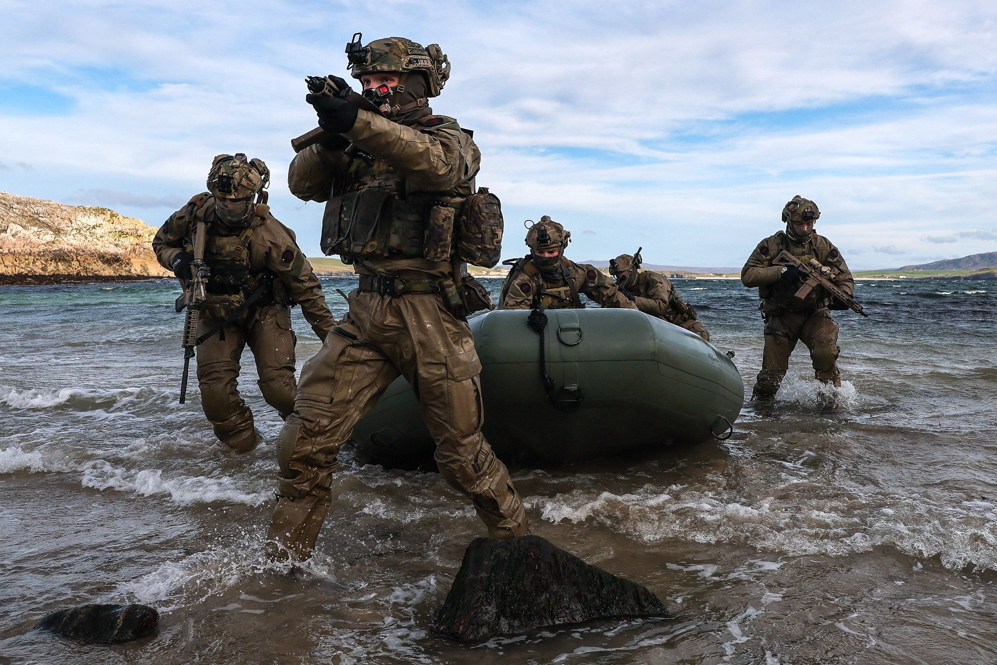 29 Sep 2026 – 148 Battery secure a remote beach in Cape Wrath. 148 (Meiktila) Commando Forward Observation Battery has conducted a Full Mission Profile (FMP), integrating a German Navy submarine and Portuguese warship during Exercise Strike Warrior 26. The serial was designed to rehearse a submarine link-up and develop the Battery’s maritime integration, including float-on/float-off drills with 148’s boats. The force subsequently conducted a submarine infiltration and discreet small-boat insertion towards the target area. The FMP culminated in the establishment of an Observation Post (OP), from which the team coordinated live Naval Surface Fires from the Portuguese warship, resulting in a successful engagement and extraction. The serial demonstrated the capability of NATO partners to integrate specialist assets and coordinate complex activity across the maritime and land domains. The submarine provided Intelligence, Surveillance and Reconnaissance (ISR) support to identify and develop the target, before deploying Special Observation Teams to conduct a tactical beach landing and establish a hasty OP. The Portuguese warship subsequently delivered live Naval Surface Fires against the designated target. “This level of complexity and coordination of live assets has not been achieved by 148 for nearly 30 years. We wanted to demonstrate to our partners across the United Kingdom Commando Force, wider UK Defence and NATO SOF community the type of missions we are prepared to execute against future threats. Warfighting is our focus, and we are prepared to employ specialist assets to deliver Multi-Domain Fires and Targeting.” - Operations Officer, 148 (Meiktila) Commando Forward Observation Battery, Royal Artillery. The UK Commando Force are taking part in their largest collective workout in 15 years to demonstrate their ability to safeguard the country – and its allies – against a myriad of threats.
