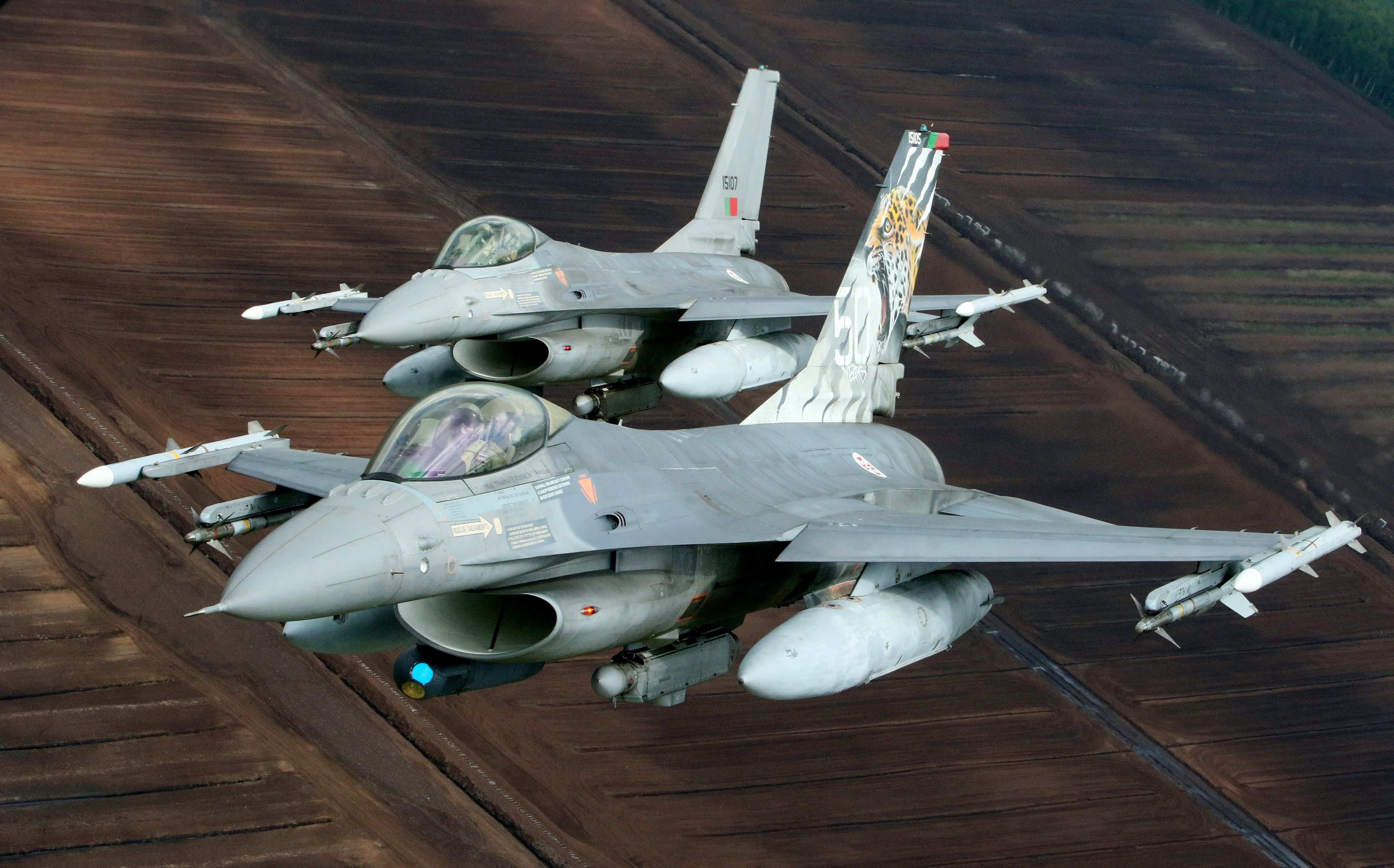 Portuguese Air Force F-16 military fighter jets participate in NATO's Baltic Air Policing Mission in Lithuanian airspace near Siauliai, on May 23, 2023. (Photo by Petras Malukas / AFP) (Photo by PETRAS MALUKAS/AFP via Getty Images)