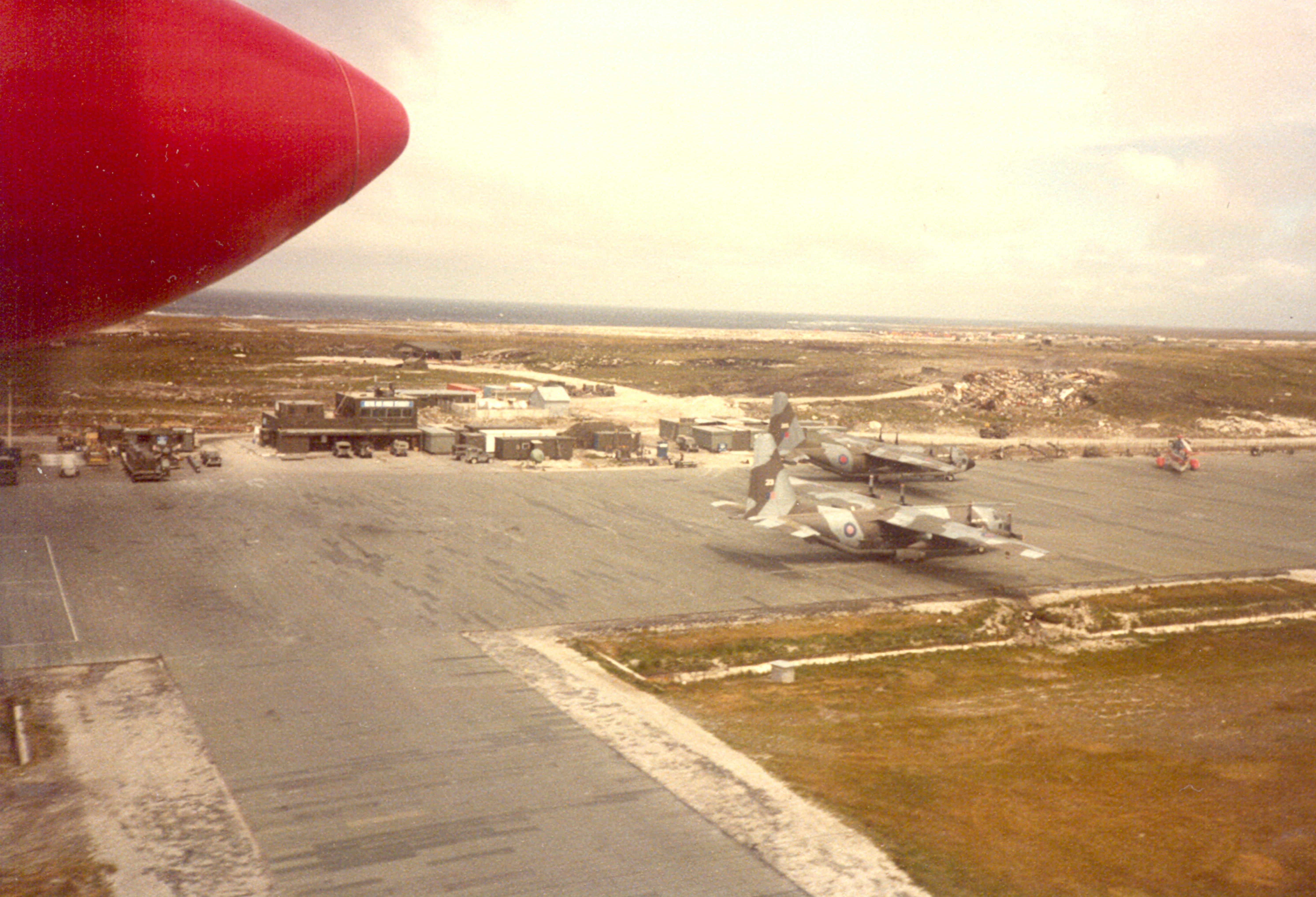 [UNVERIFIED CONTENT] Overflying Stanley Airfield in a Brittan Norman Islander. November 1983 with two C130 Hercules Aircraft on the Airfield.