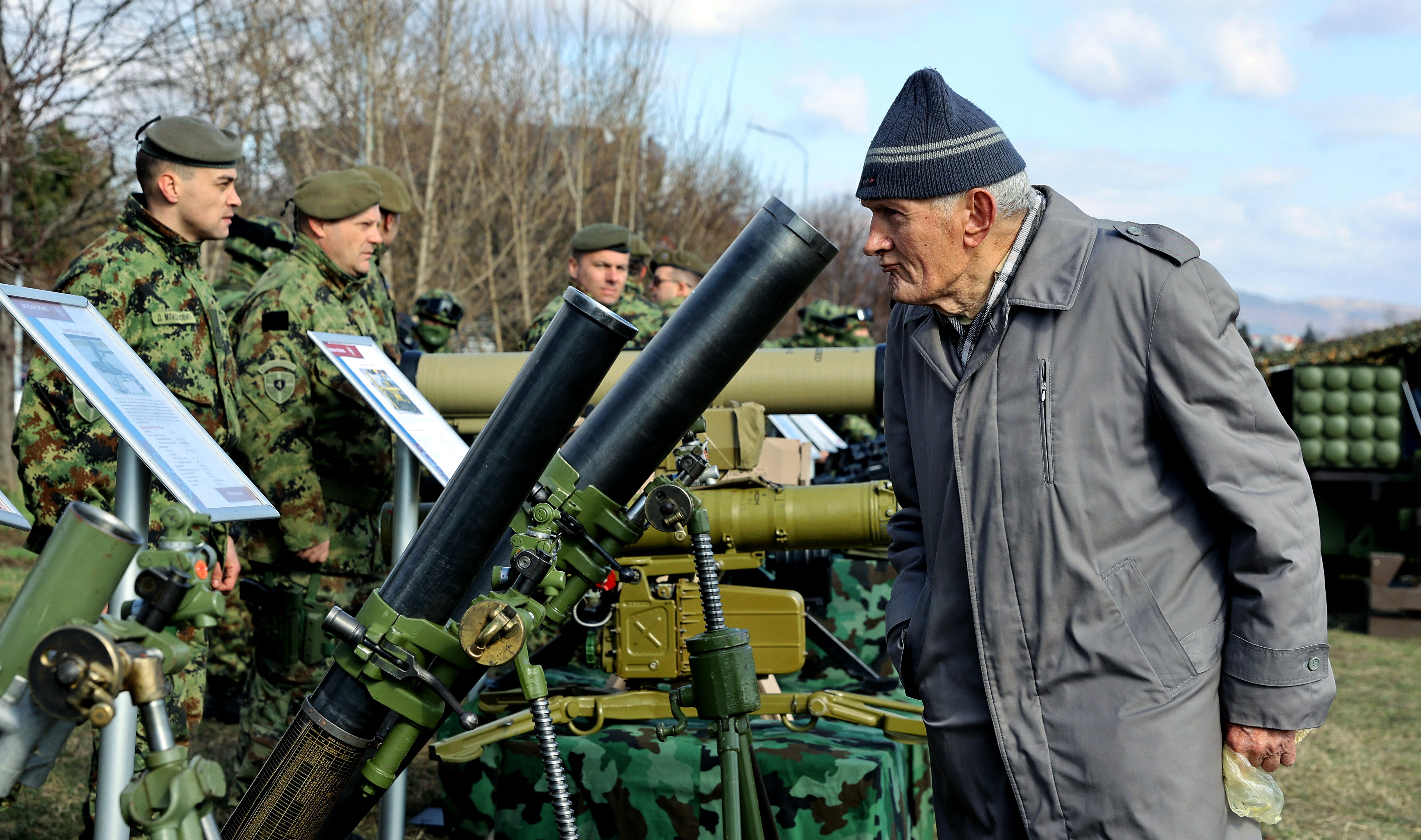 A visitor looks at mortars at an exhibition of Serbia's armed forces in Nis, southern Serbia, on February 14, 2024, ahead of Serbia's Statehood Day. (Photo by SASA DJORDJEVIC / AFP) (Photo by SASA DJORDJEVIC/AFP via Getty Images)