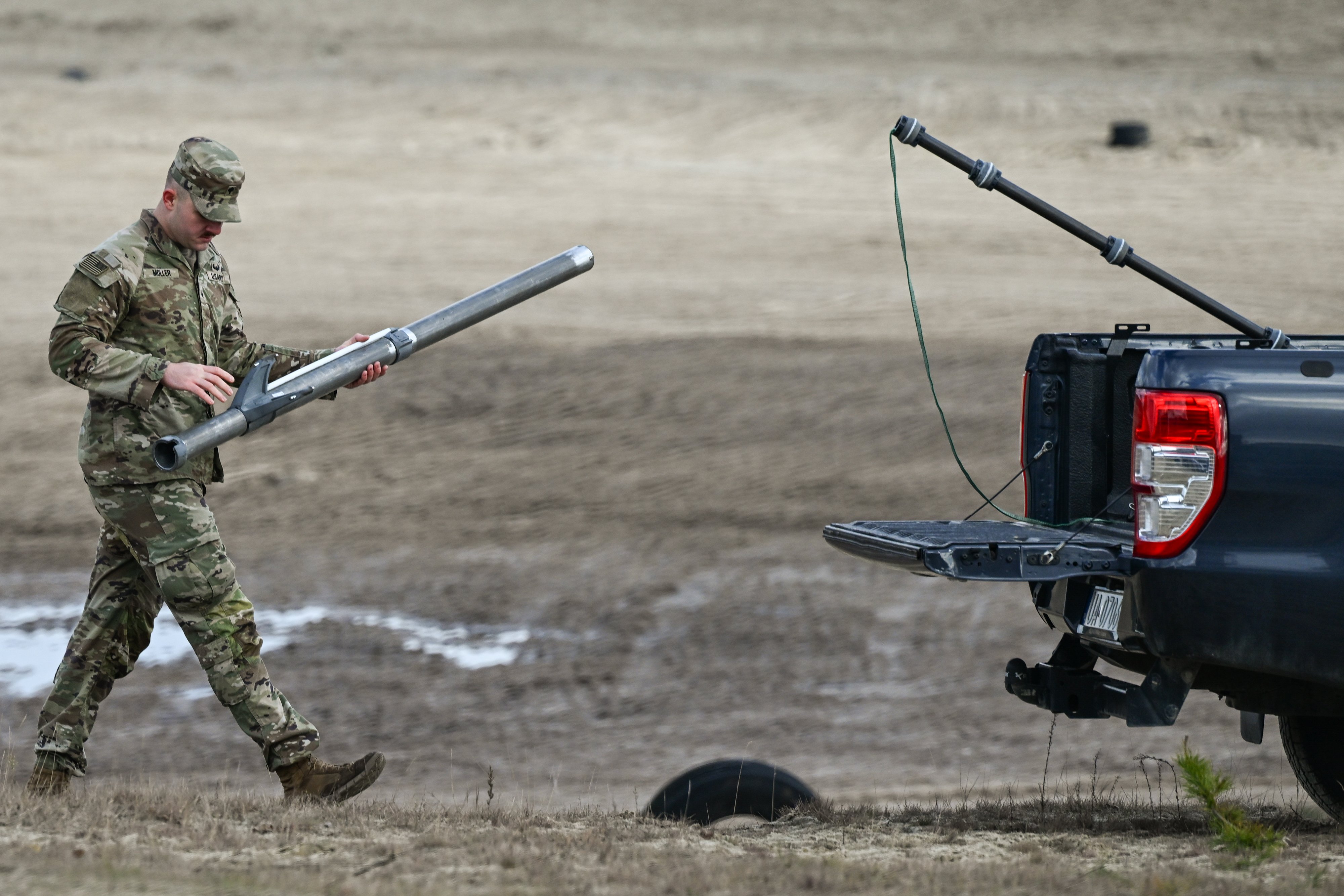 DEBA, POLAND NOVEMBER 18: A U.S. Army soldier carries a component of the U.S. counter-drone system known as 'MEROPS' after launching an AS3 Surveyor interceptor drone during a live-fire demonstration at the Deba training grounds in Subcarpathian Voivodeship, Poland, on November 18, 2025. The drill is part of NATO's Eastern Sentry initiative to enhance vigilance and strengthen defenses against drone threats along the alliance's eastern border. (Photo by Artur Widak/NurPhoto via Getty Images)