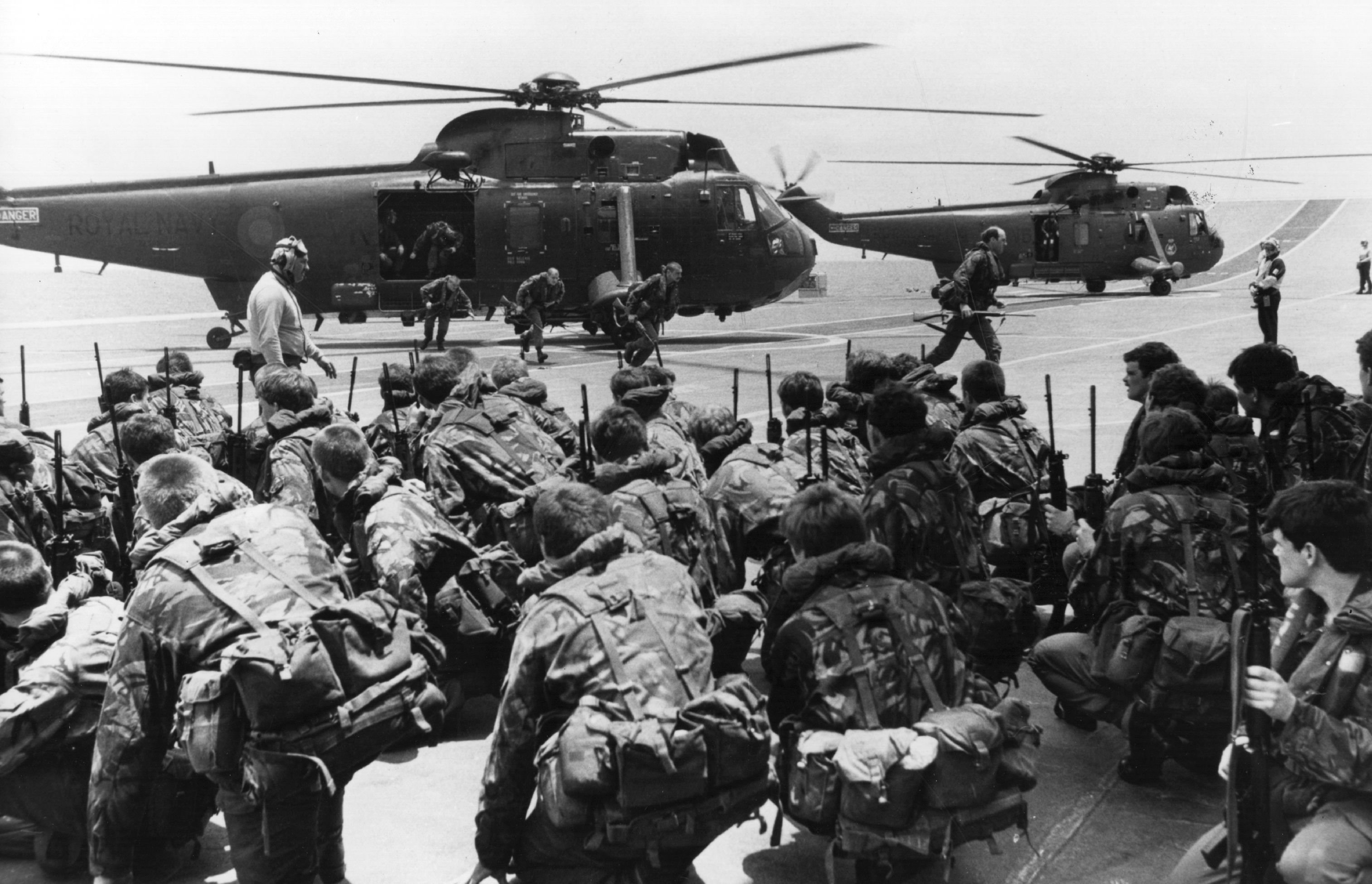 A View of commandos being lifted from the decks of HMS Hermes and HMS Invincible to be transferred by Westland Sea King helicopters to other ships while two aircraft carriers forge ahead to the Falkland Islands from Ascension Island, leaving the marines ready to move at short notice. (Photo by Fox Photos/Getty Images)