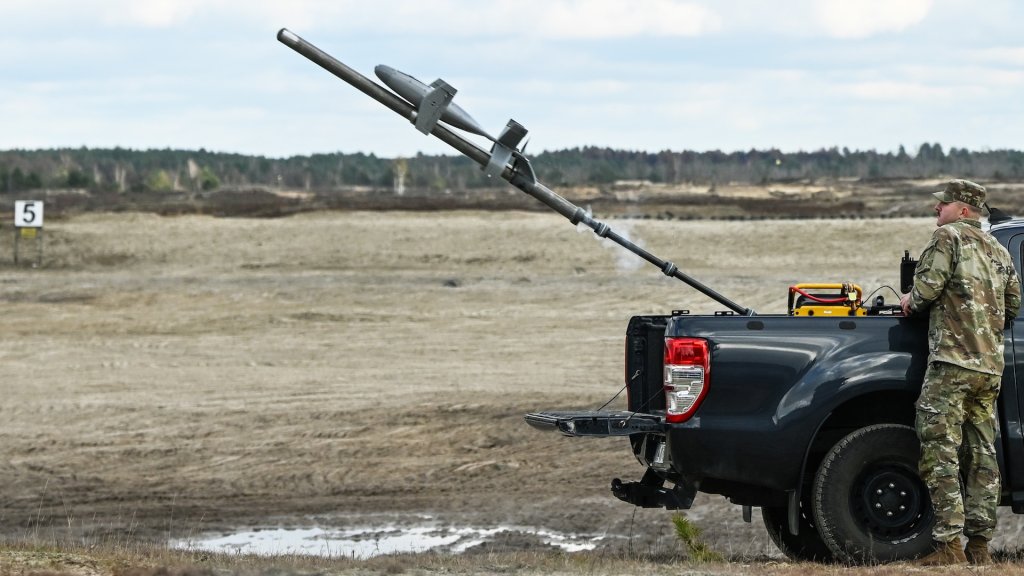 DEBA, POLAND NOVEMBER 18: A U.S. Army soldier launches an AS3 Surveyor interceptor drone, part of the MEROPS U.S. counter-drone system, during a live-fire demonstration at the Deba training grounds in Subcarpathian Voivodeship, Poland, on November 18, 2025. The drill is part of NATO's Eastern Sentry initiative to enhance vigilance and strengthen defenses against drone threats along the alliance's eastern border. (Photo by Artur Widak/NurPhoto via Getty Images)