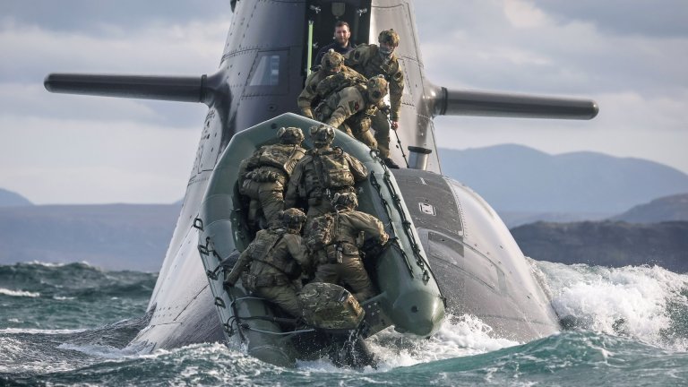 29 Sep 2026 – Meiktila Commandos board German U-Boat off the North coast of Scotland during Strike Warrior 26. 148 (Meiktila) Commando Forward Observation Battery has conducted a Full Mission Profile (FMP), integrating a German Navy submarine and Portuguese warship during Exercise Strike Warrior 26. The serial was designed to rehearse a submarine link-up and develop the Battery’s maritime integration, including float-on/float-off drills with 148’s boats. The force subsequently conducted a submarine infiltration and discreet small-boat insertion towards the target area. The FMP culminated in the establishment of an Observation Post (OP), from which the team coordinated live Naval Surface Fires from the Portuguese warship, resulting in a successful engagement and extraction. The serial demonstrated the capability of NATO partners to integrate specialist assets and coordinate complex activity across the maritime and land domains. The submarine provided Intelligence, Surveillance and Reconnaissance (ISR) support to identify and develop the target, before deploying Special Observation Teams to conduct a tactical beach landing and establish a hasty OP. The Portuguese warship subsequently delivered live Naval Surface Fires against the designated target. “This level of complexity and coordination of live assets has not been achieved by 148 for nearly 30 years. We wanted to demonstrate to our partners across the United Kingdom Commando Force, wider UK Defence and NATO SOF community the type of missions we are prepared to execute against future threats. Warfighting is our focus, and we are prepared to employ specialist assets to deliver Multi-Domain Fires and Targeting.” - Operations Officer, 148 (Meiktila) Commando Forward Observation Battery, Royal Artillery. The UK Commando Force are taking part in their largest collective workout in 15 years to demonstrate their ability to safeguard the country – and its allies – against a myriad of threats.