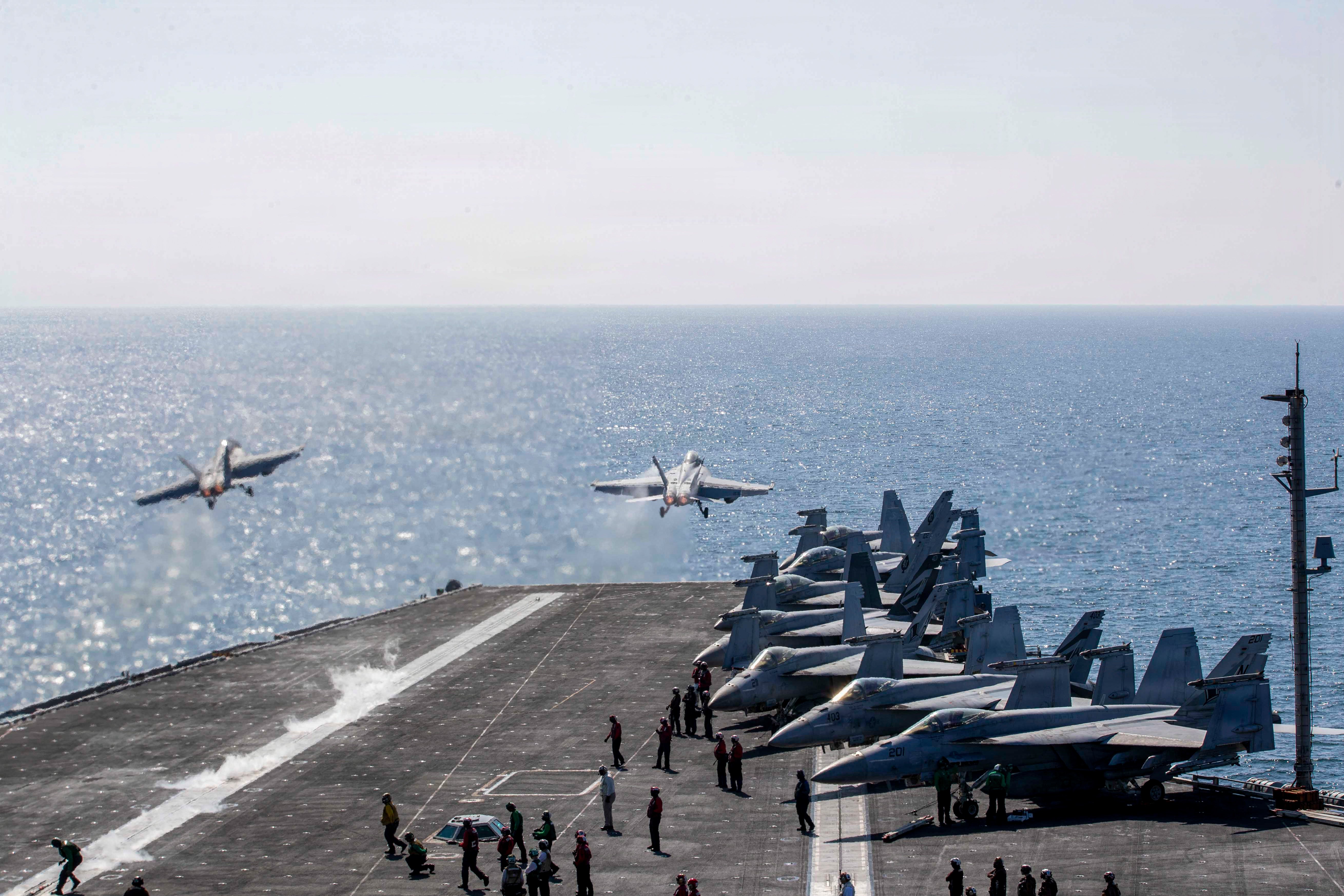 Two F/A-18 Super Hornets launch from the flight deck of Nimitz-class aircraft carrier USS Abraham Lincoln (CVN 72) in support of Operation Epic Fury, March 3, 2026. (U.S. Navy photo)