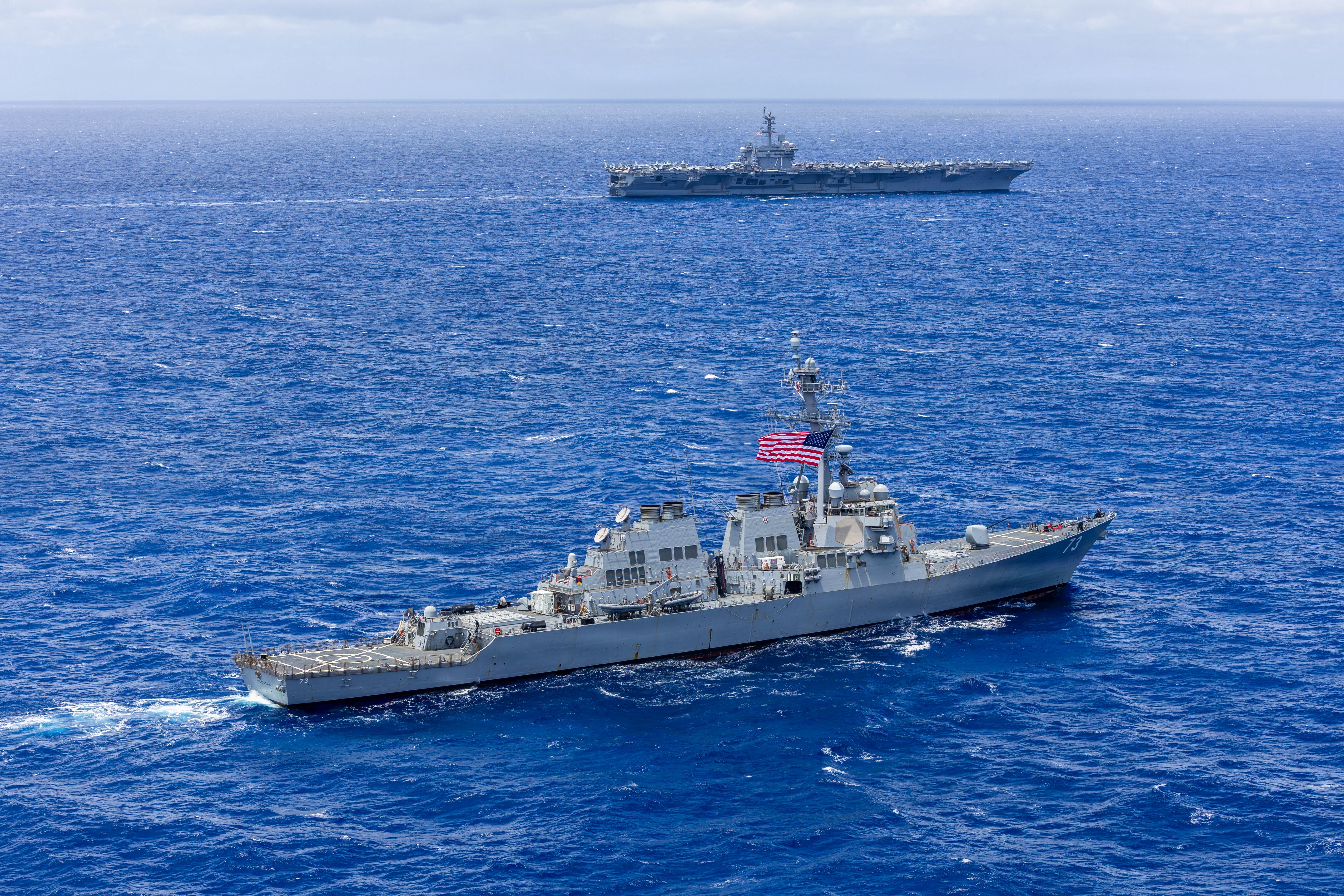 Arleigh Burke-class guided-missile destroyer USS Decatur (DDG 73) sails in formation during Exercise Rim of the Pacific 2026 in the Pacific Ocean off the coast of Hawaii on July 22, 2026. Thirty nations, 30 ships, five submarines, 15 national land forces, more than 190 aircraft and more than 30,000 personnel are participating in RIMPAC in and around the Hawaiian Islands, June 24 to July 31. The world's largest international maritime exercise, RIMPAC provides a unique training opportunity while fostering and sustaining cooperative relationships among participants critical to ensuring the safety of sea lanes and security on the world's oceans. RIMPAC 2026 is the 30th exercise in the series that began in 1971. (U.S. Navy photo by Mass Communication Specialist First Class Ryan A. LeCompte)