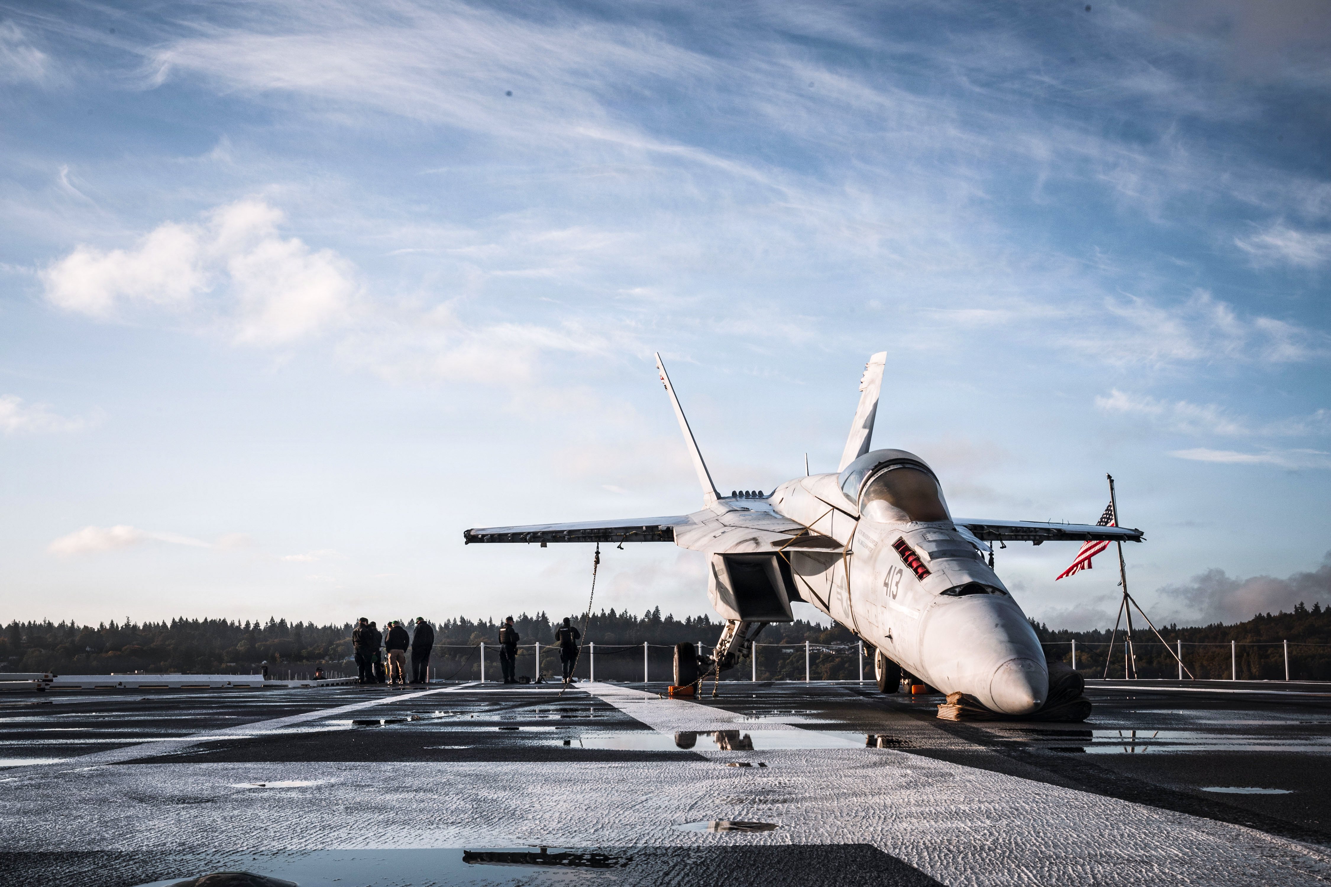 U.S. Navy Sailors conduct security operations on the flight deck of USS Ronald Reagan (CVN 76), while Reagan pulls out of Naval Base Kitsap-Bremerton, Washington, Sept. 30, 2026. The Nimitz-class aircraft carrier USS Ronald Reagan is underway conducting routine training in U.S. 3rd Fleet area of operations (U.S. Navy photo by Mass Communication Specialist Seaman Alexis Bueno)