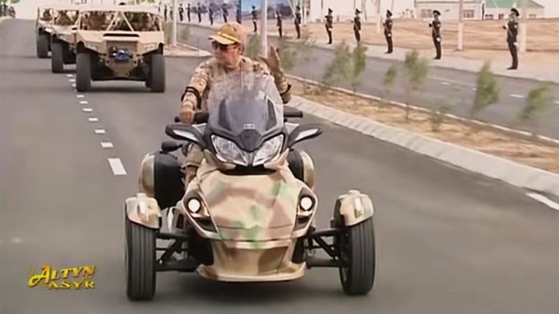 Turkmenistan’s Trike-Riding President Can’t Miss In This Horribly Awesome Propaganda Video