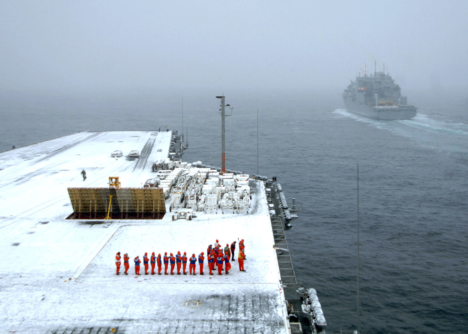 message-editor%2F1483956718773-us_navy_070207-n-9475m-029_snow_blankets_the_flight_deck_of_the_nimitz-class_aircraft_carrier_uss_harry_s._truman_cvn_75_as_crew_members_prepare_for_an_ammunition_onload_with_the_military_sealift_command_msc_dry_cargo-ammun.jpg