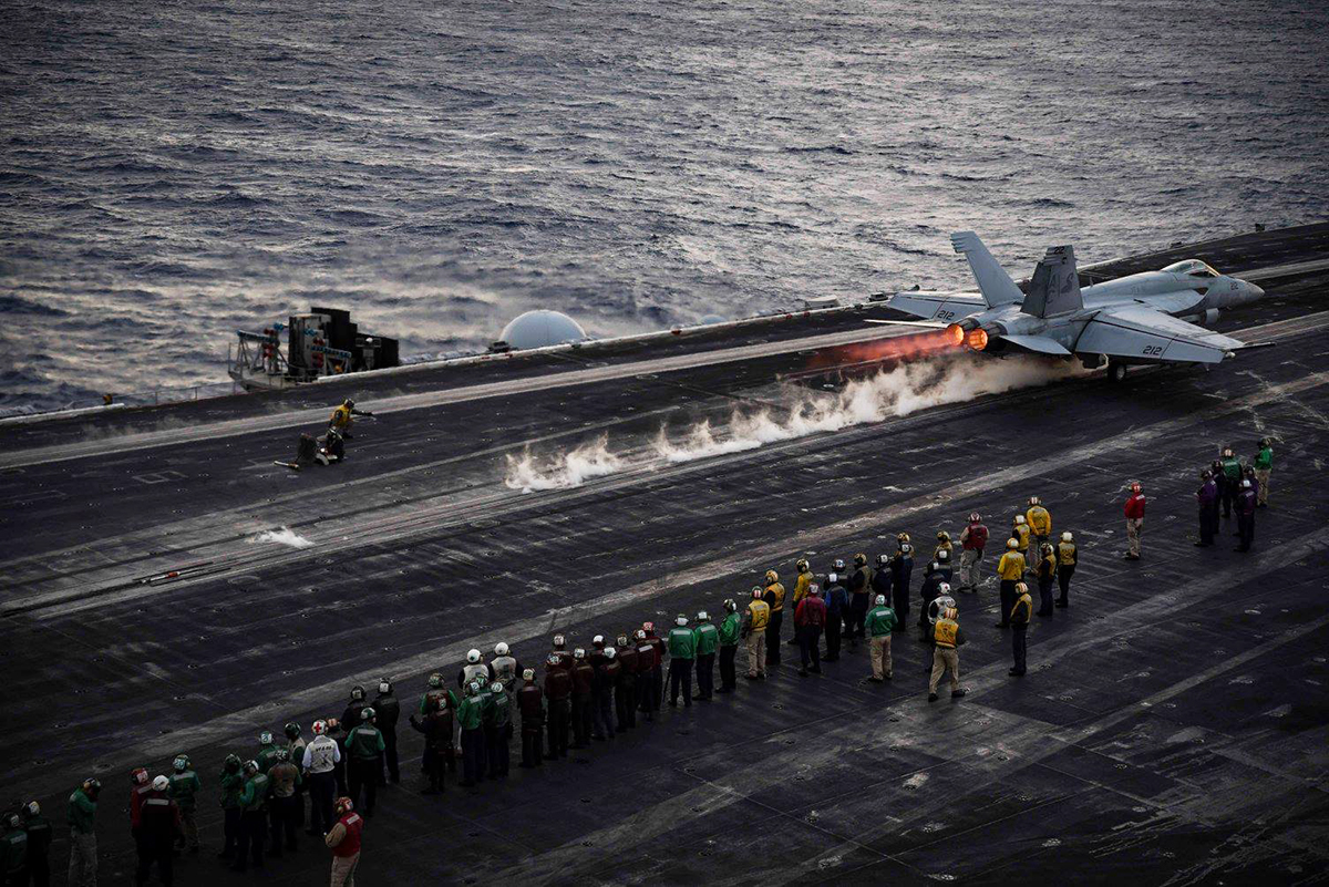 A Hornet catapults off the Ike's deck during the Air Wing fly-off on December 29th.